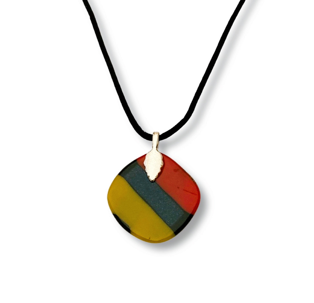 Colorful dichroic fused glass pendant in red, blue, yellow, purple, green and gold colors with a black satin cord. By 3D Glass Designs.