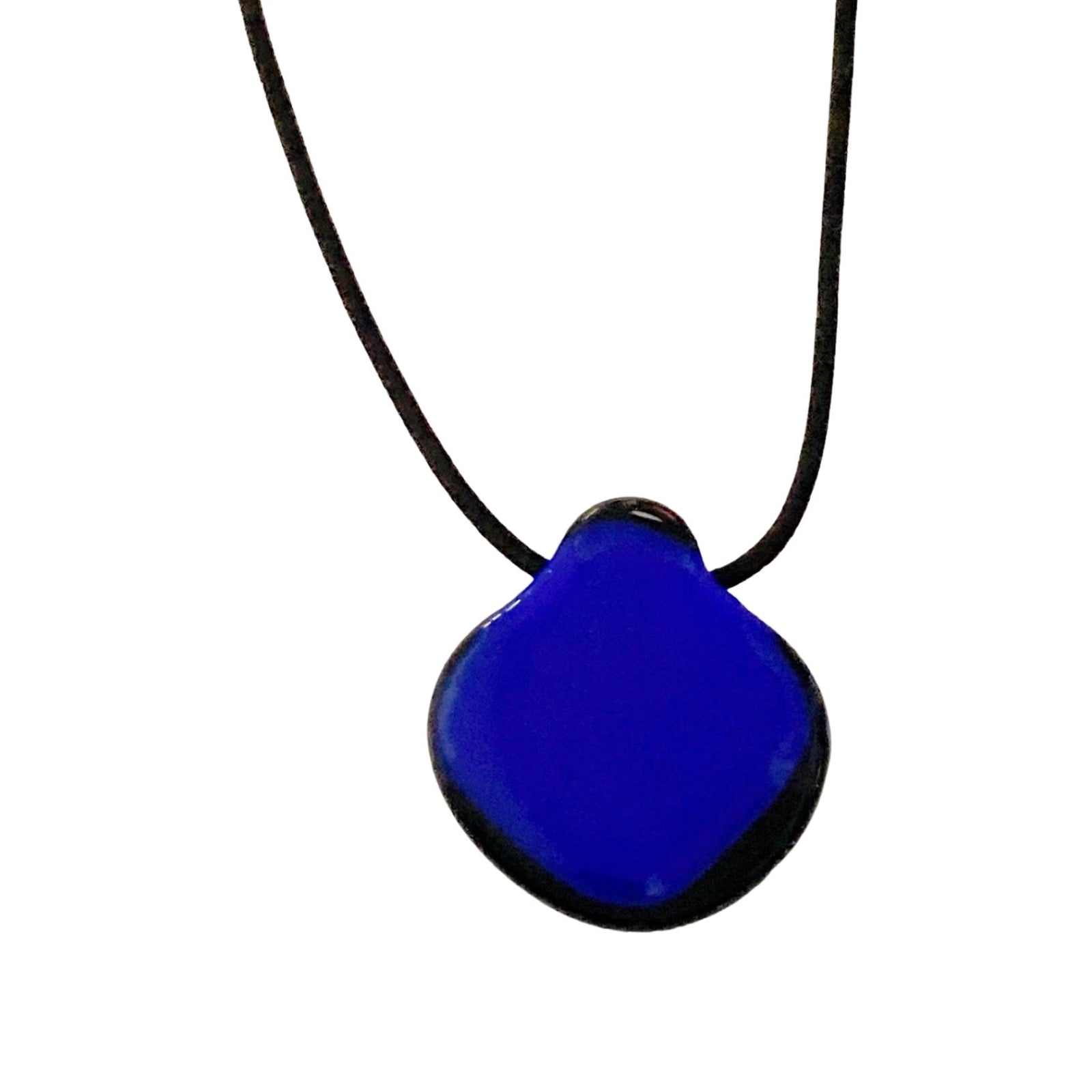 Blue glass pendant edged in black on a black leather cord against a white background.