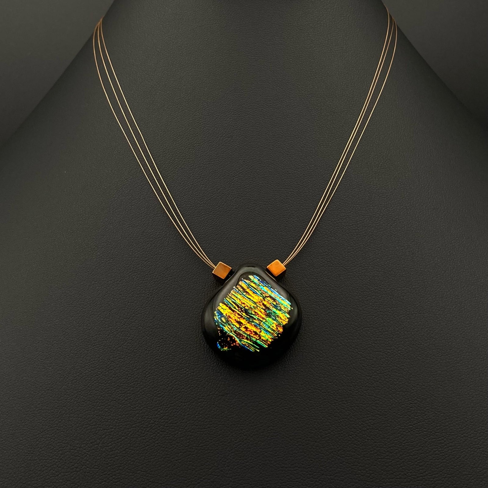 Small glass pendant on a delicate three-strand necklace, by 3D Glass Designs.