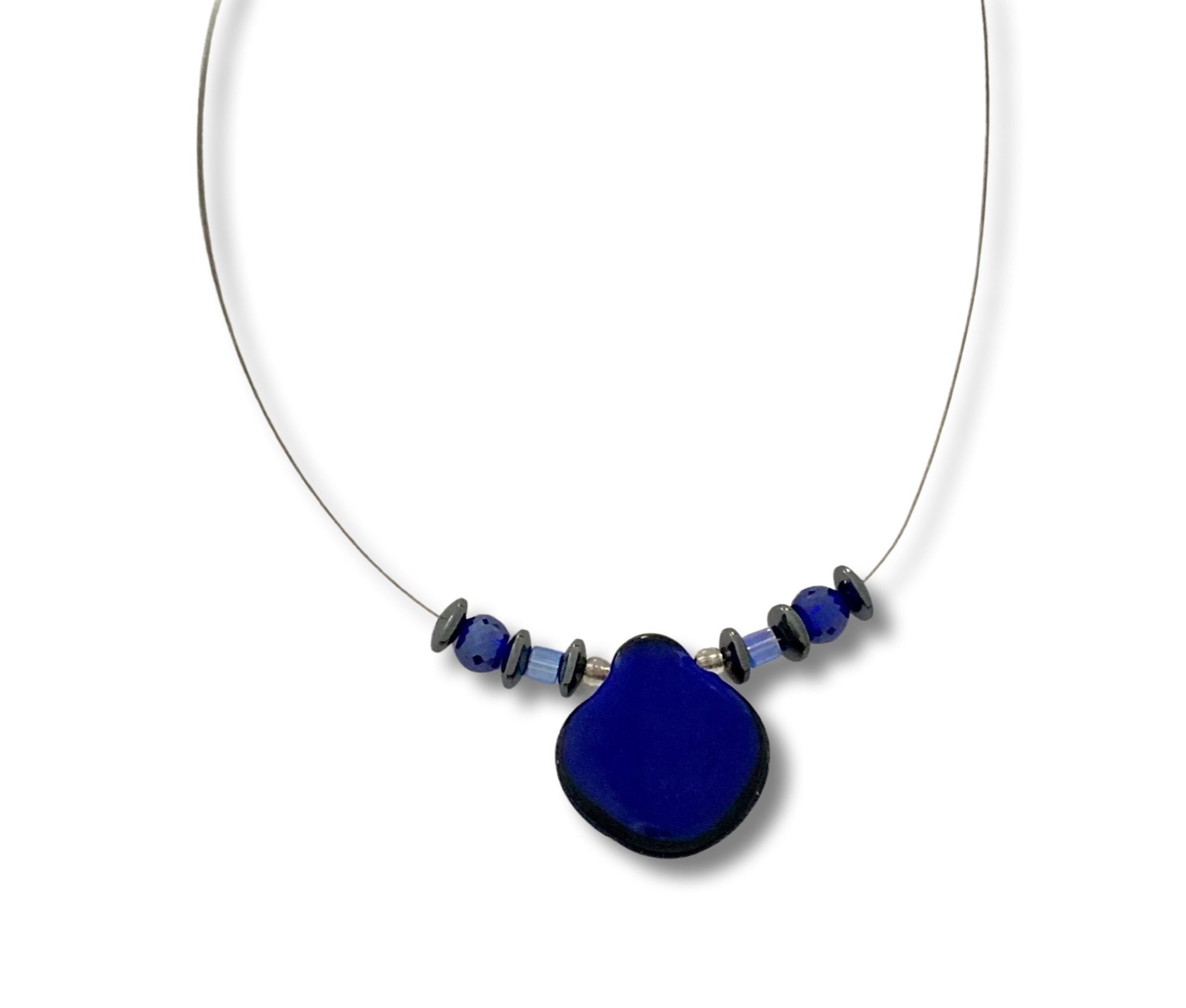 Handmade floating beaded necklace against a white background, by 3D Glass Designs.