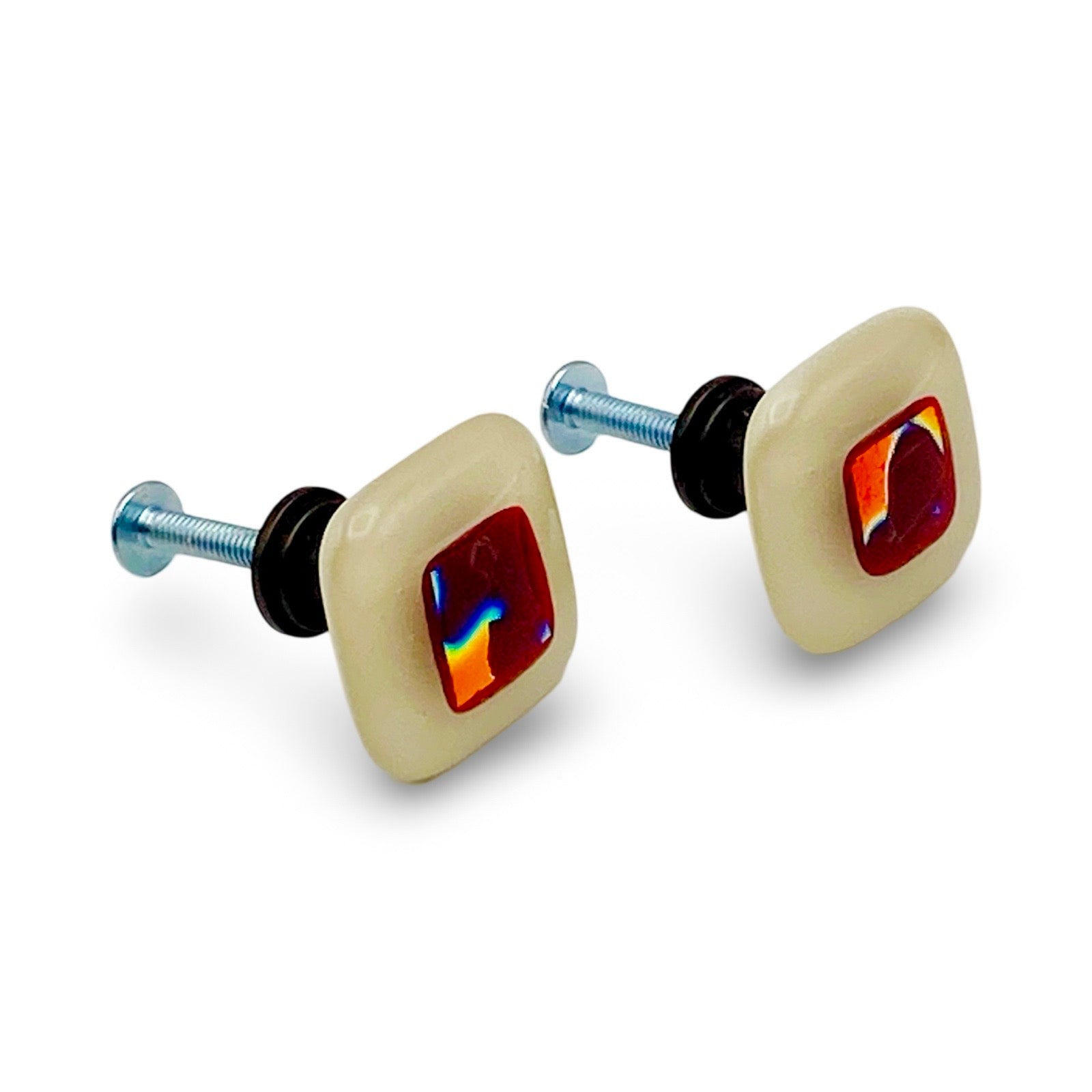A pair of dichroic glass custom made cabinet hardware, by 3D Glass Designs.
