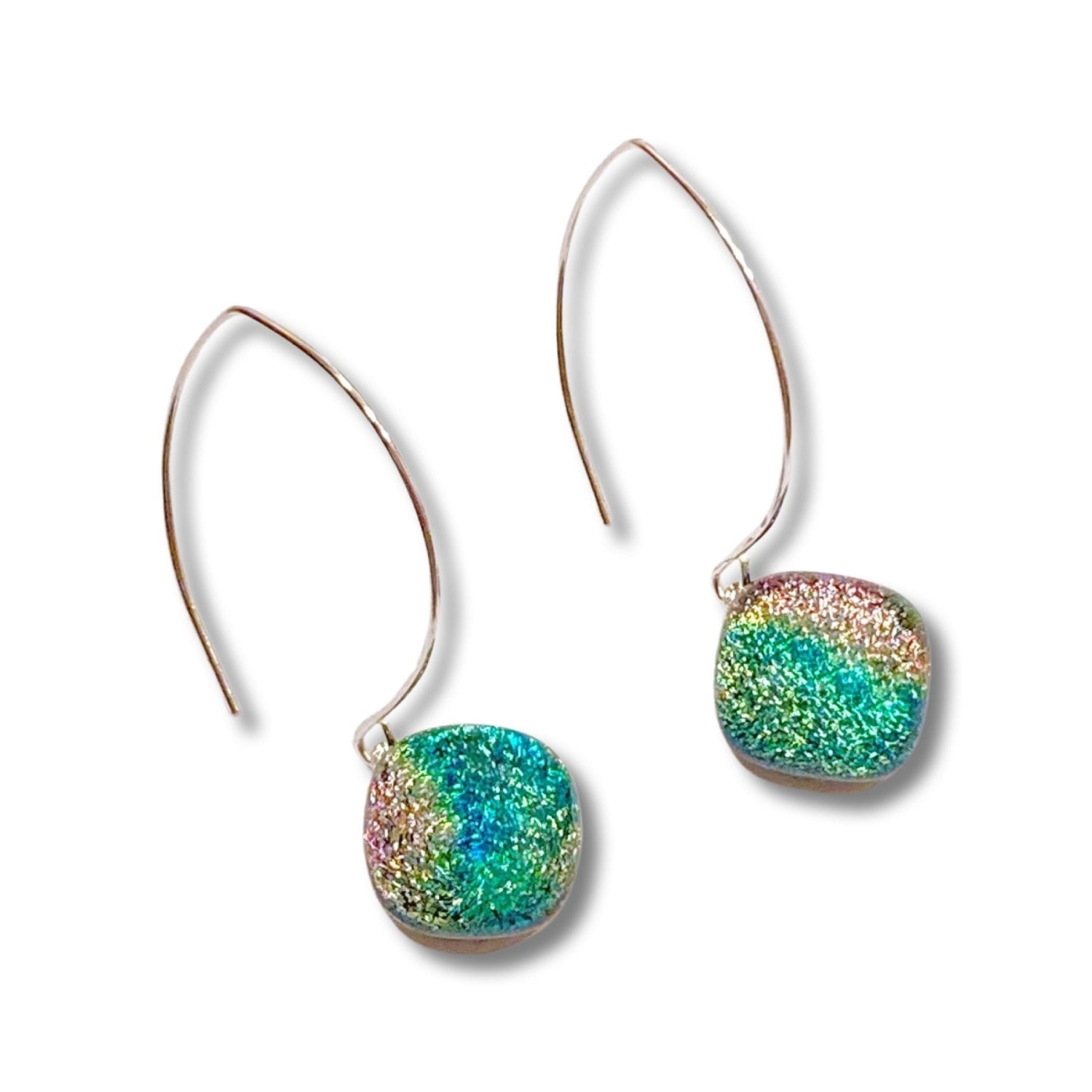 A pair of long earrings with fused glass dangles, by 3D Glass Designs.