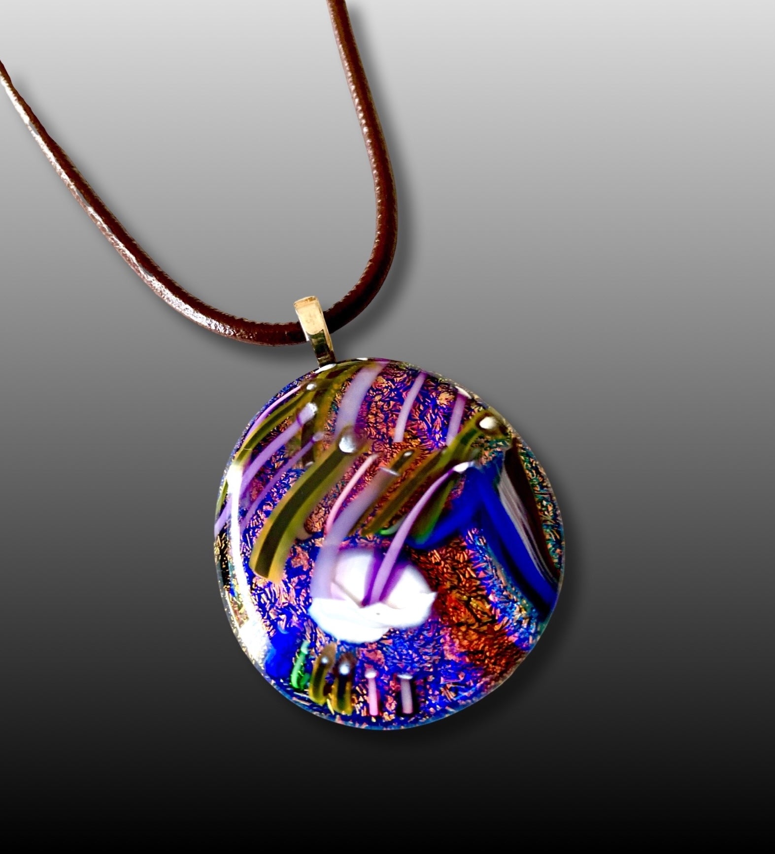 Unique dichroic glass pendant in blue, orange and purple with a one-of-a-kind handblown glass design. By 3D Glass Designs.