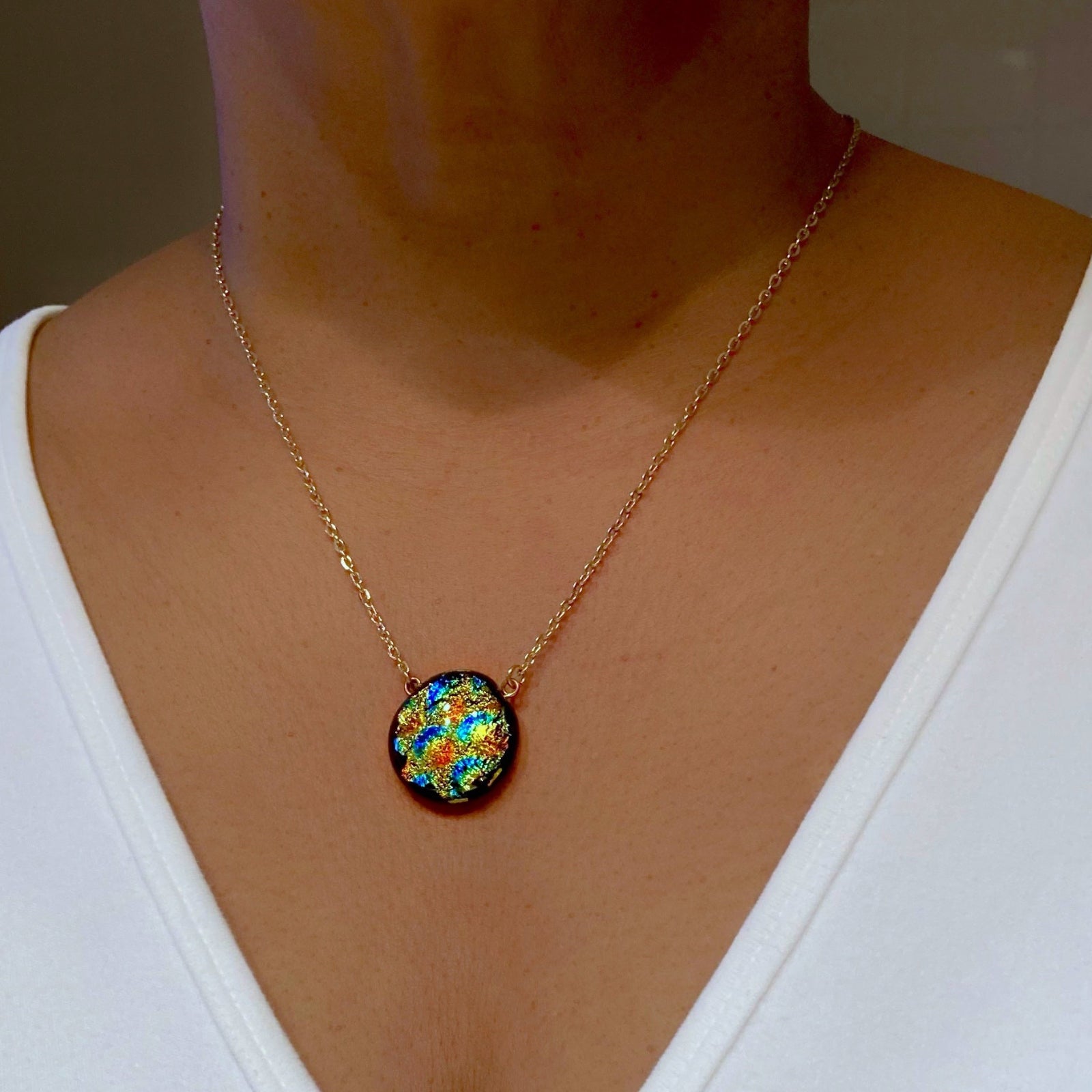 Model wearing colorful glass and gold chain necklace, by 3D Glass Designs.