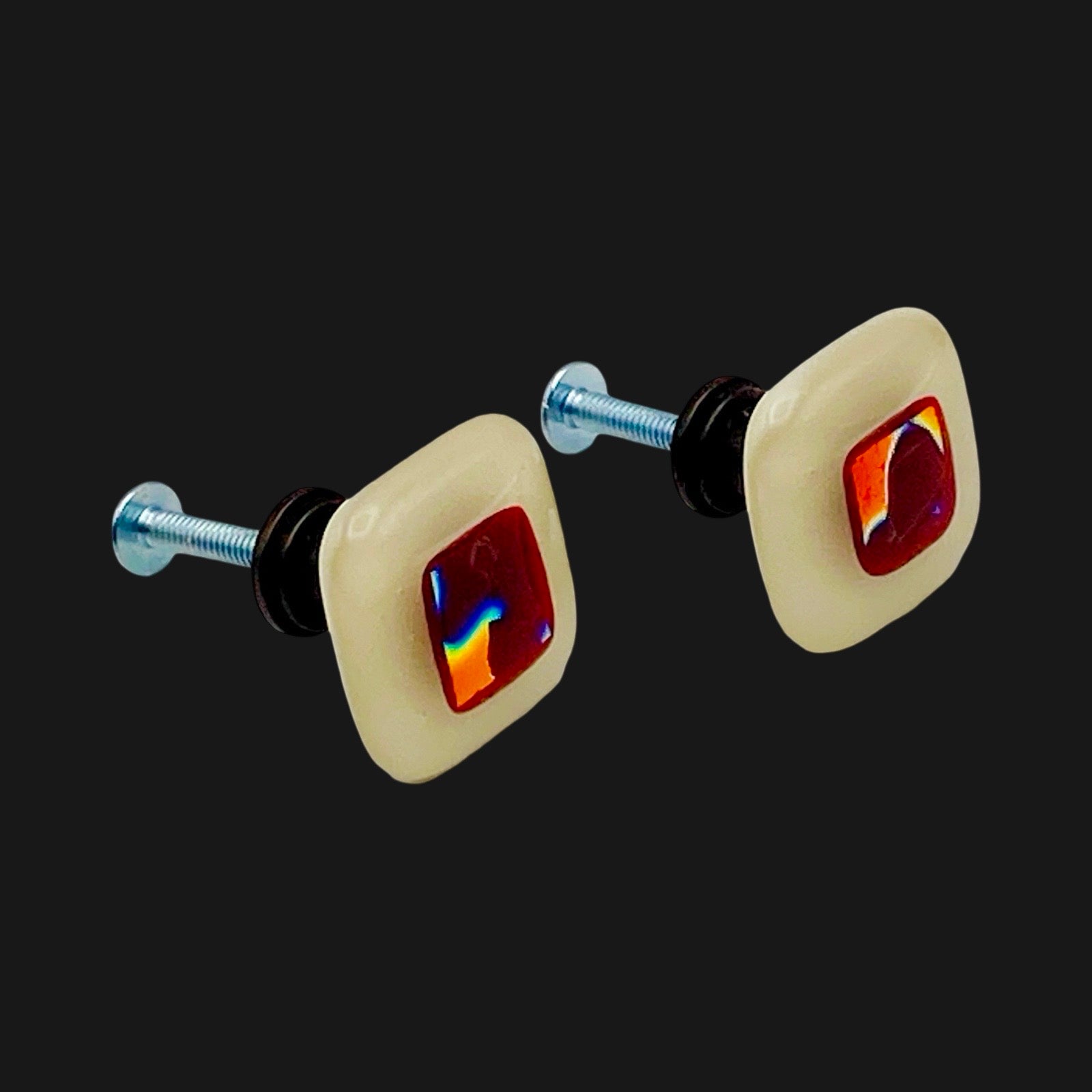 Two ream and red fused glass cabinet knobs with oil rubbed bronze hardware, by 3D Glass Designs.