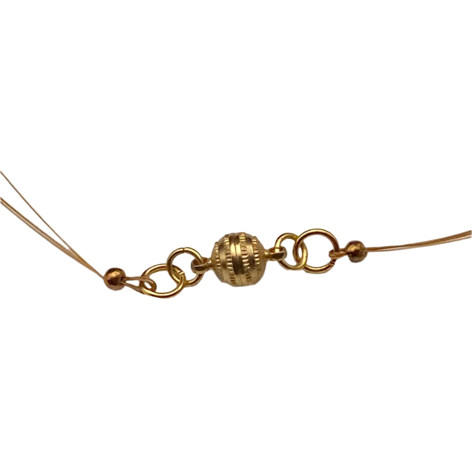Gold magnetic clasp attached to gold beading wire.