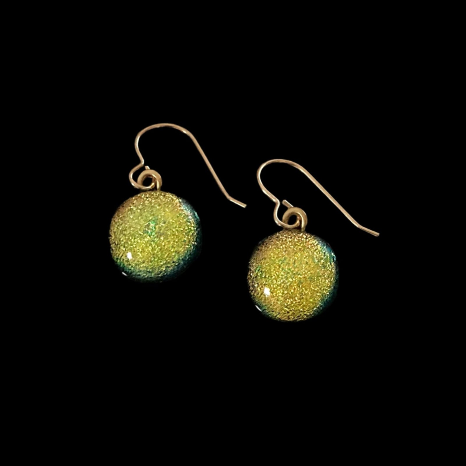 A pair of yellow pierced earrings on a black background, by 3D Glass Designs.