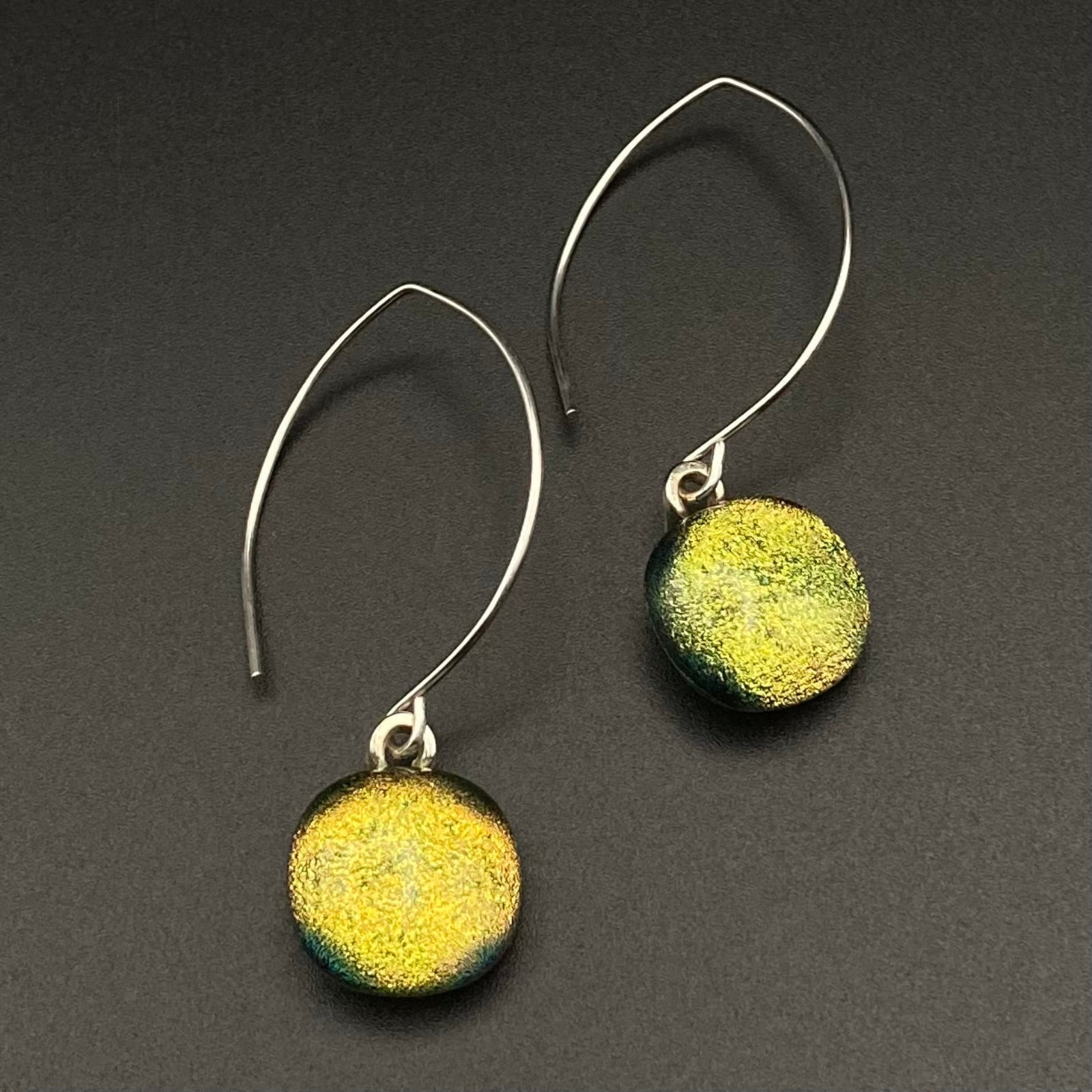 A pair of long ear wires with glass dangles, by 3D Glass Designs.