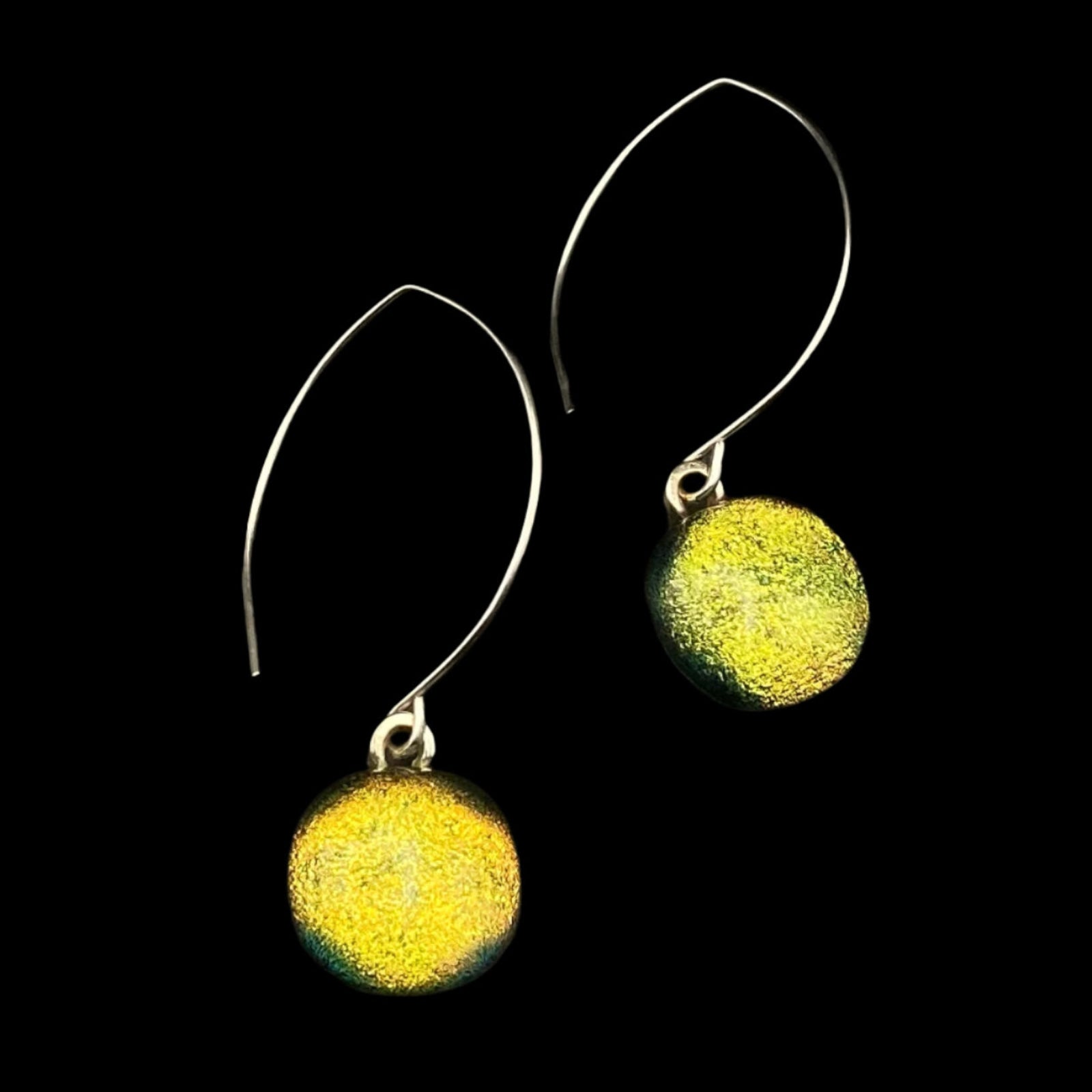 Handmade glass dangle earrings on a silver ear wire on a black background, by 3D Glass Designs.