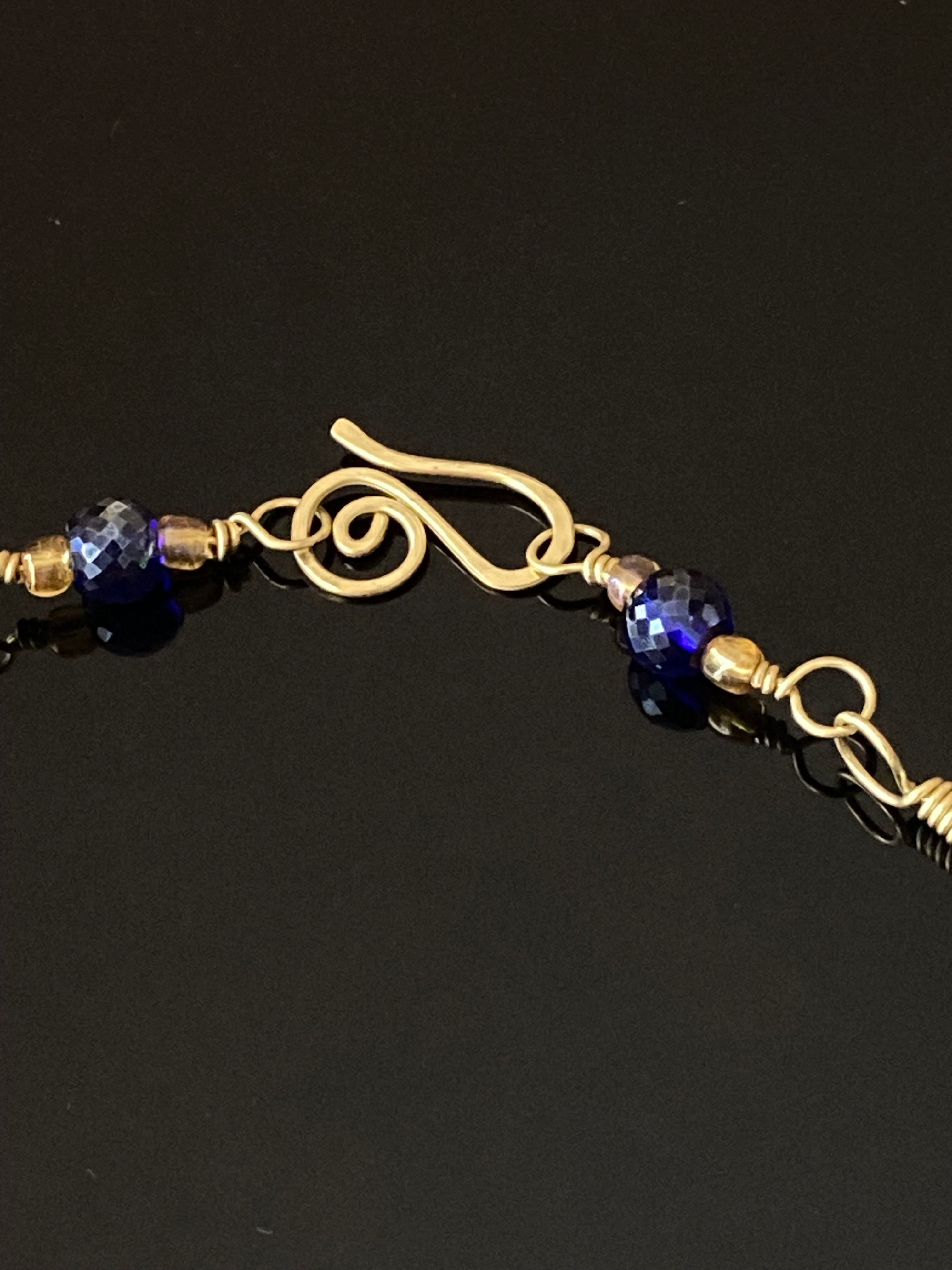 Handcrafted brass clasp with beads, by 3D Glass Designs.