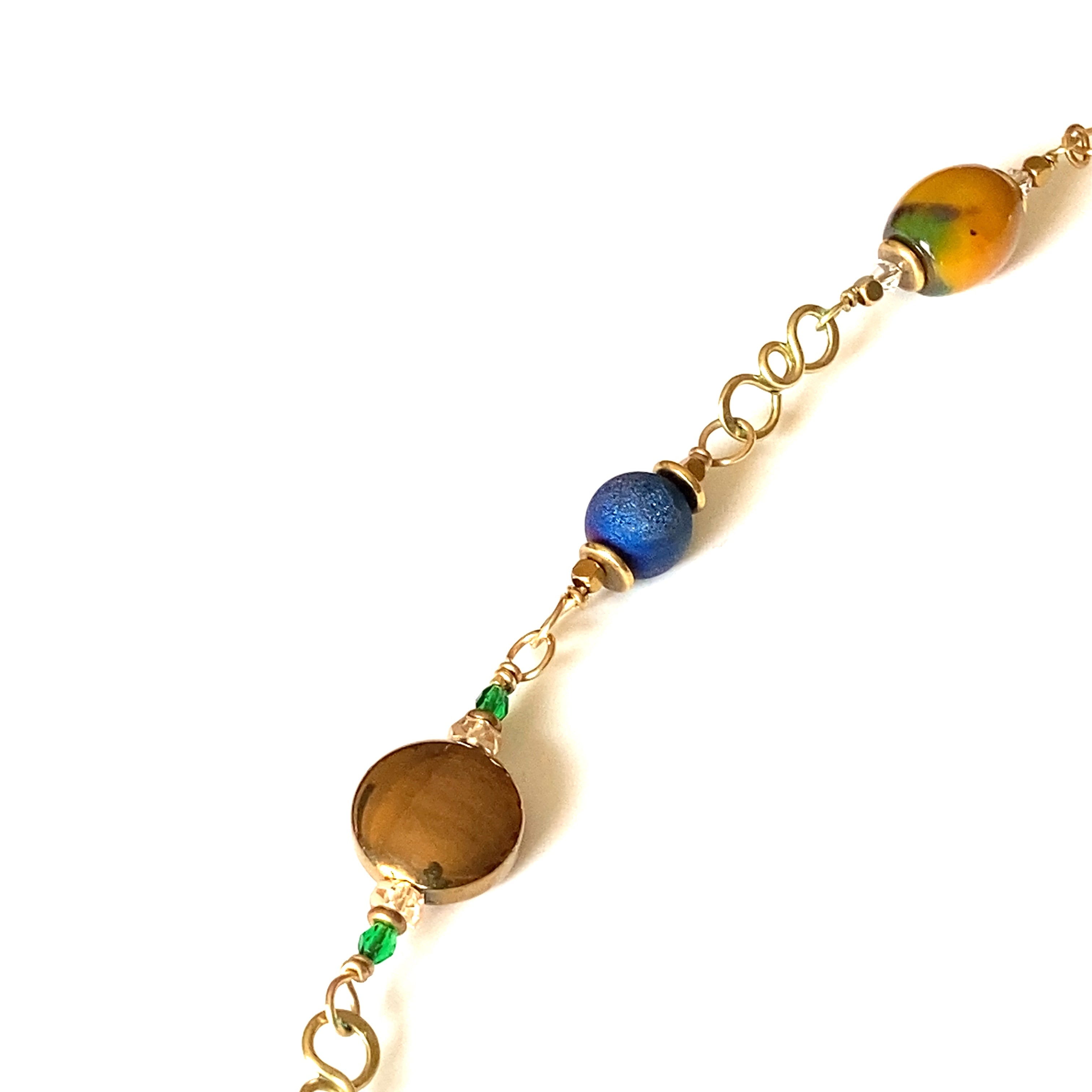 Partial details of handmade beaded link necklace.