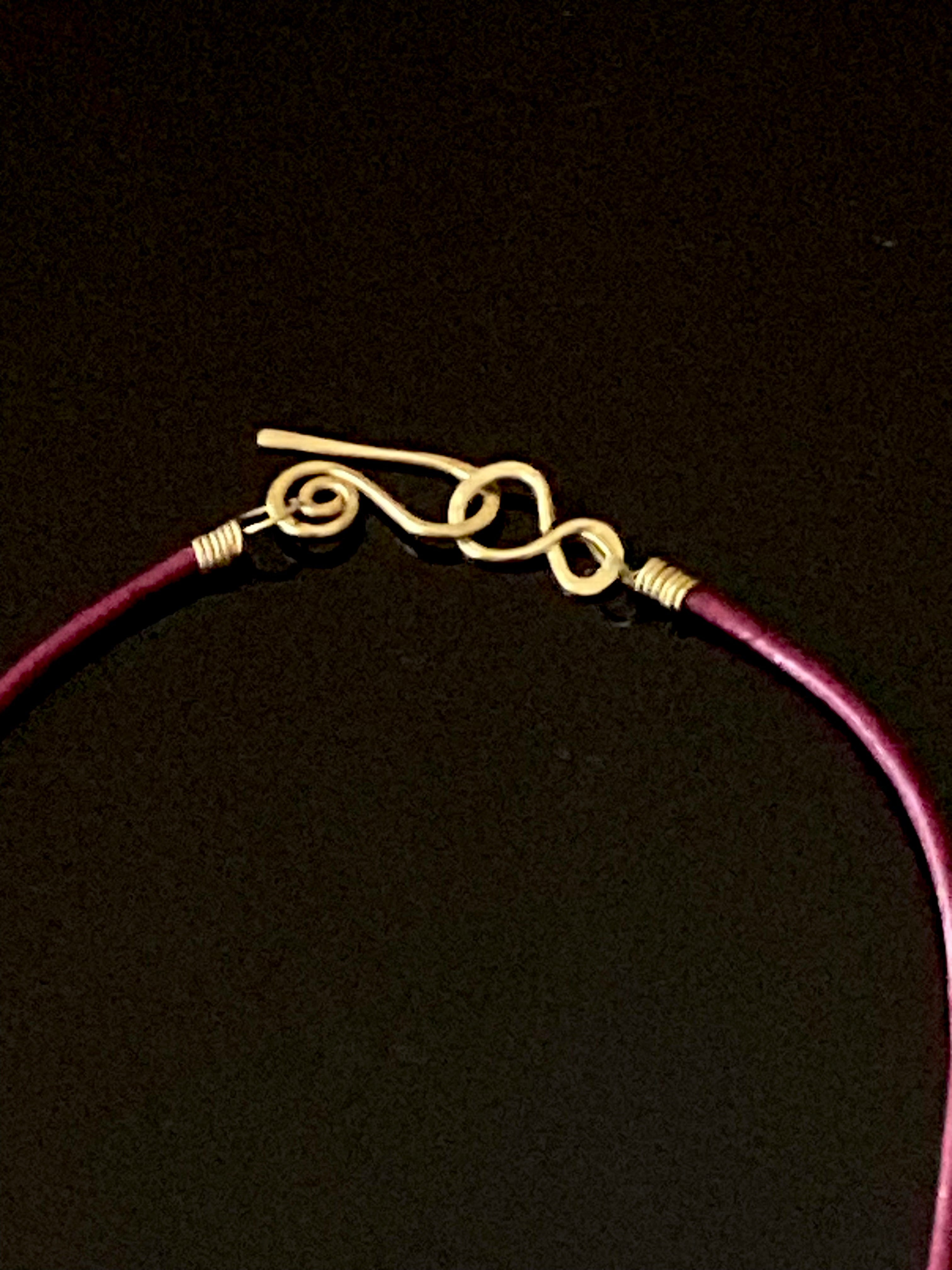 Handmade clasp and burgundy leather cord by 3D Glass Designs.