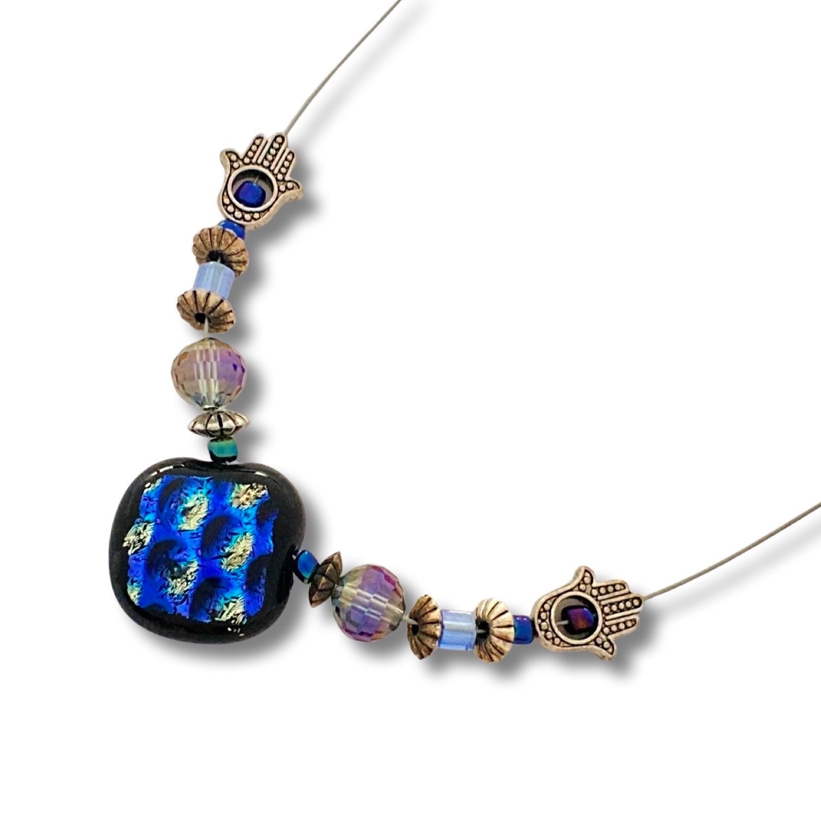 Illusion necklace featuring a blue dichroic glass pendant, glass and silver-plated beads on a white background, by 3D Glass Designs.