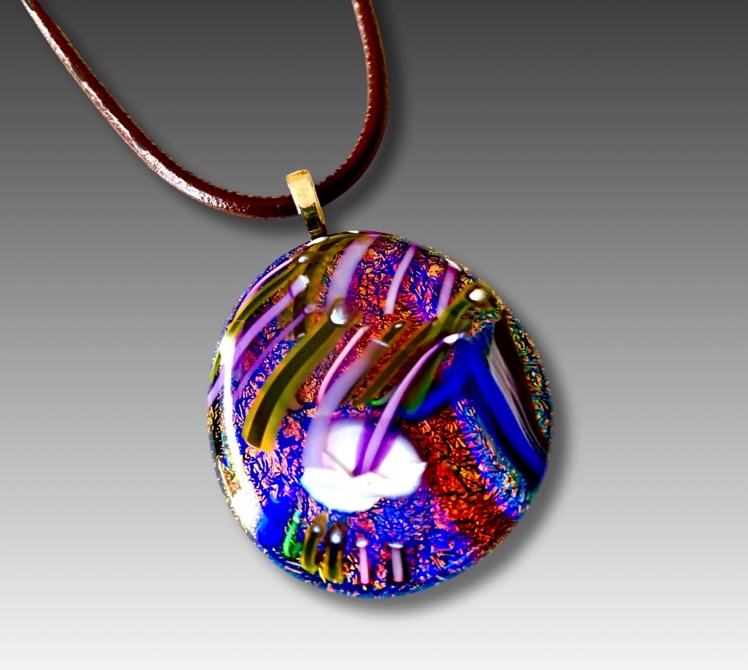 Large dichroic glass pendant in vibrant color of blue, orange and purple with a unique handblown glass design. By 3D Glass Designs.