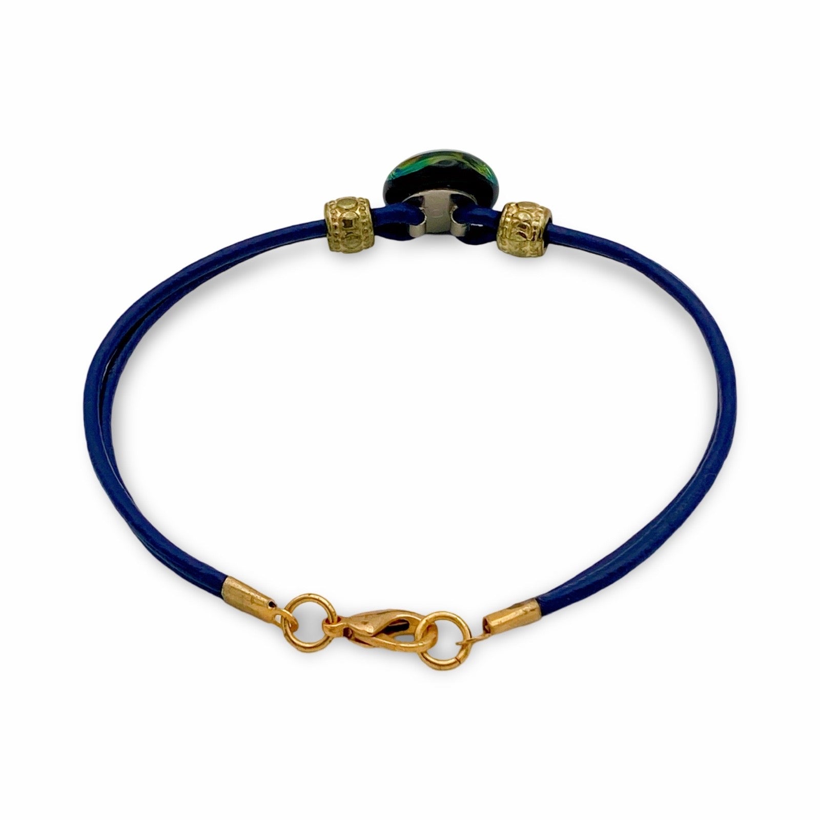 Back of handmade blue leather bracelet with green dichroic glass, by 3D Glass Designs.