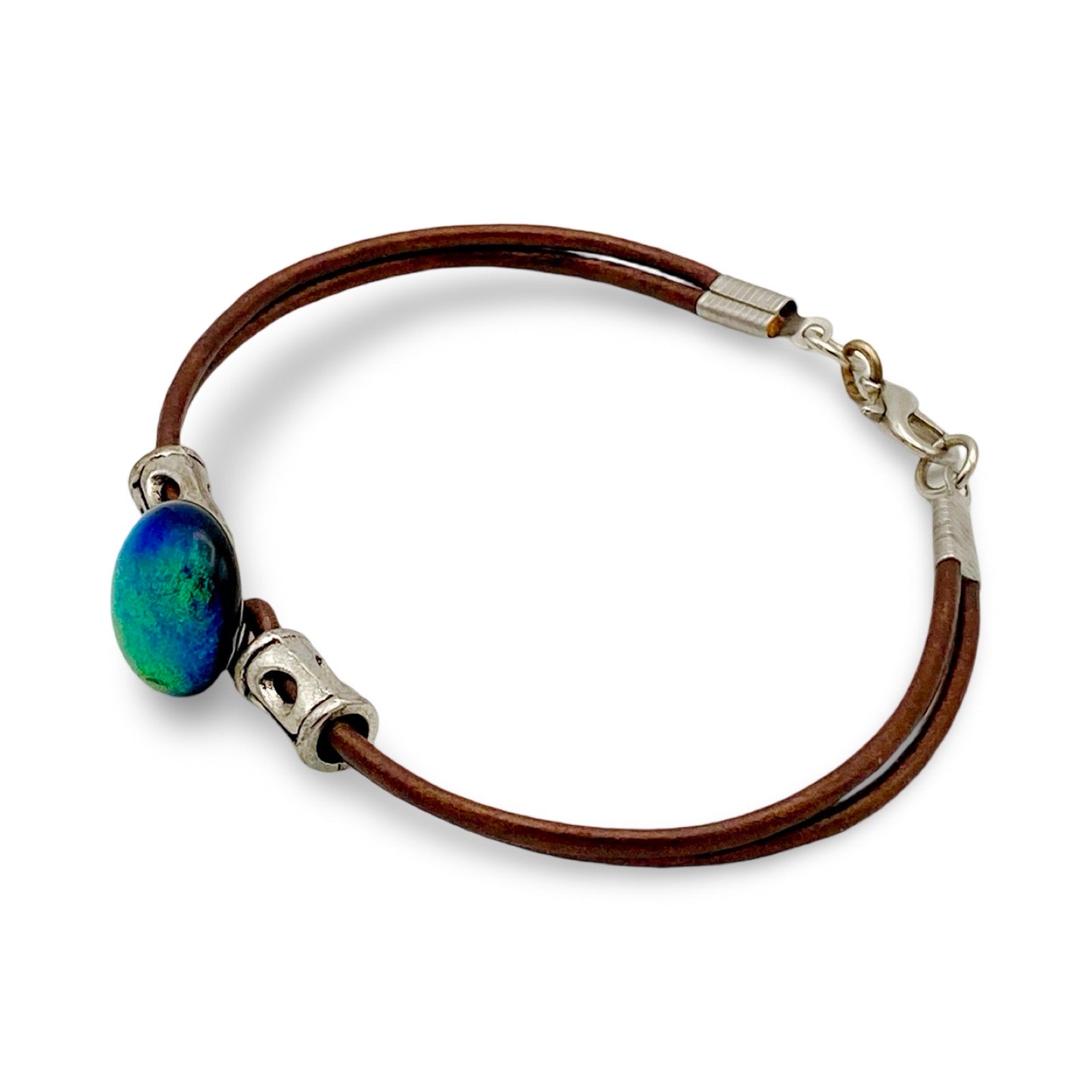 Green fused glass with metallic bronze leather cord. handmade by 3D Glass designs.