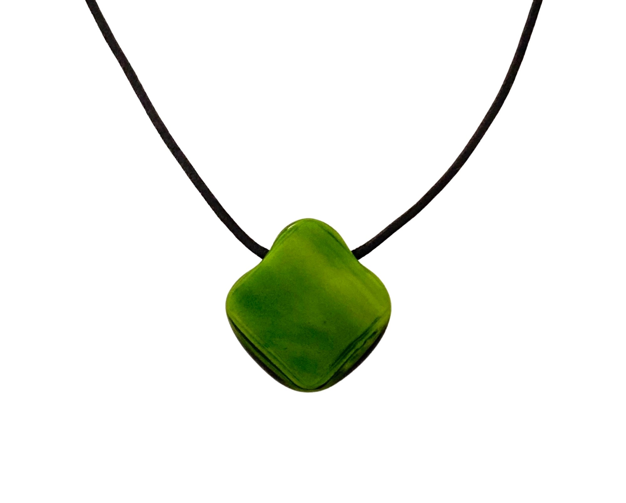 Green glass pendant on a black leather cord against a white background, by 3D Glass Designs.