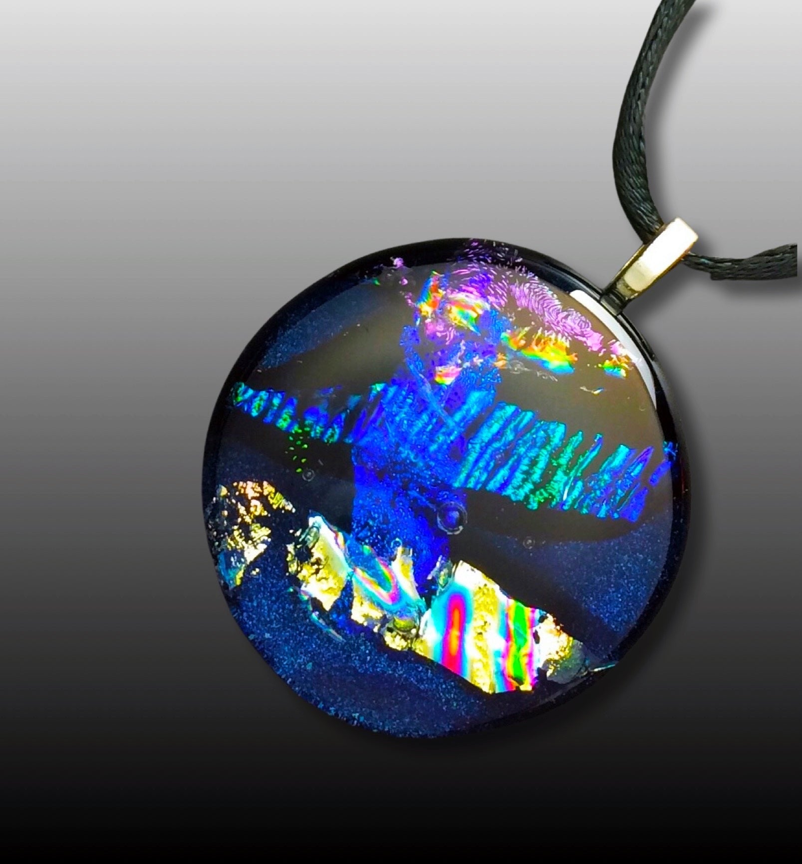 Round dichroic glass pendant in midnight blue, purple, silver and teal, by 3DGlass Designs.