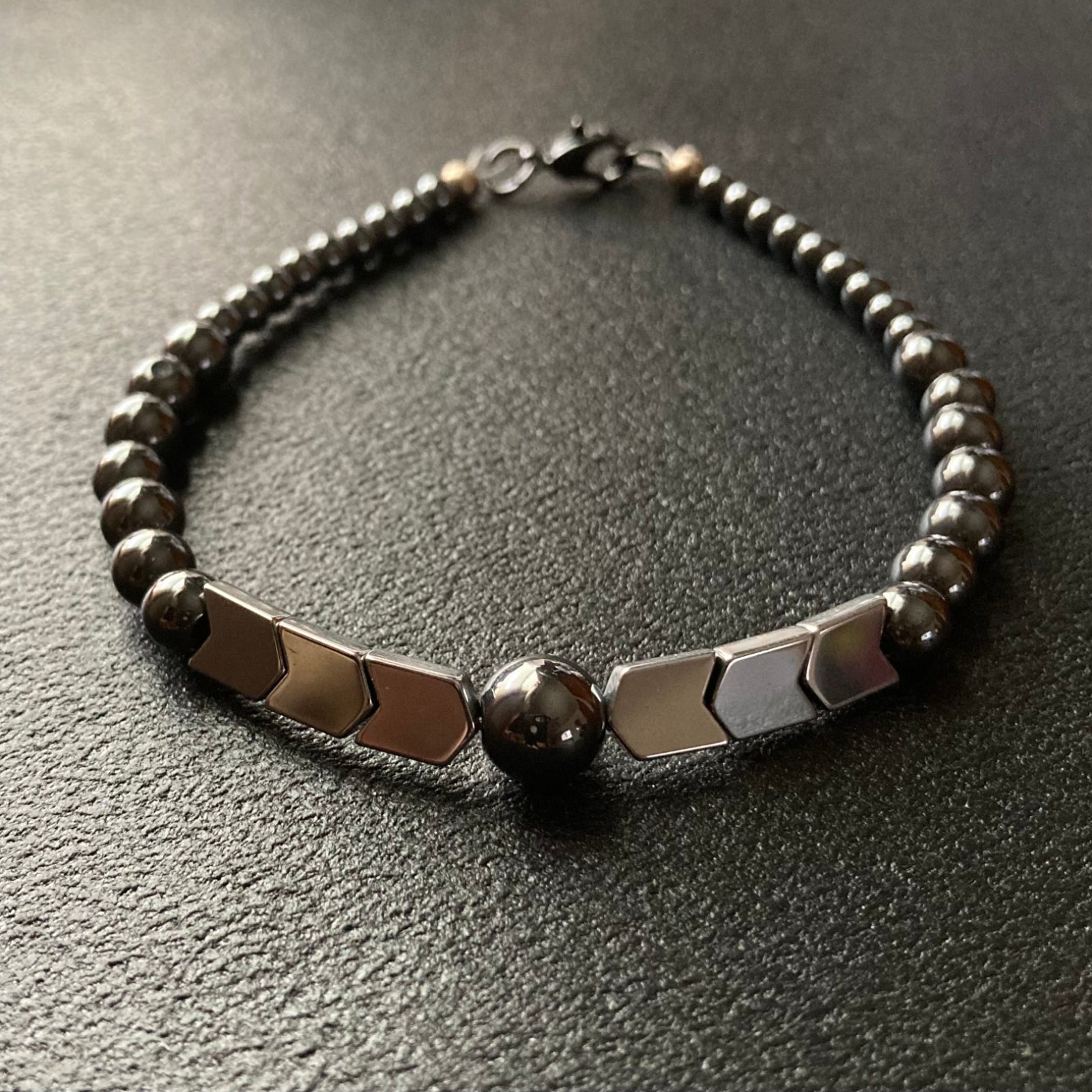 Men's hematite bracelet with grey round beads and silver arrow shaped beads, by 3D Glass designs.