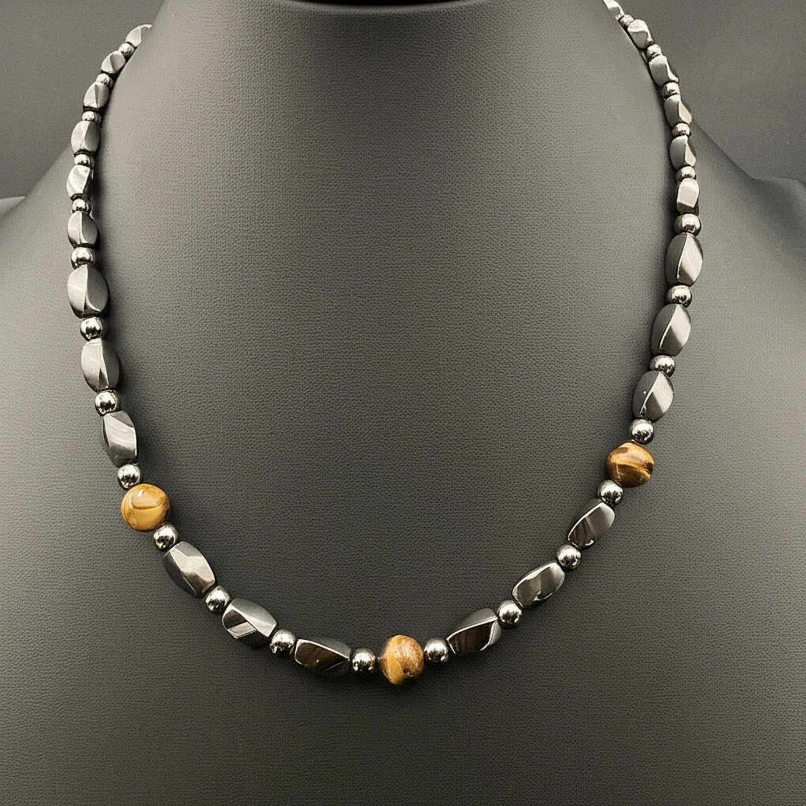 Men's beaded hematite and tiger's eye necklace on a black jewelry bust, by 3D Glass Designs.