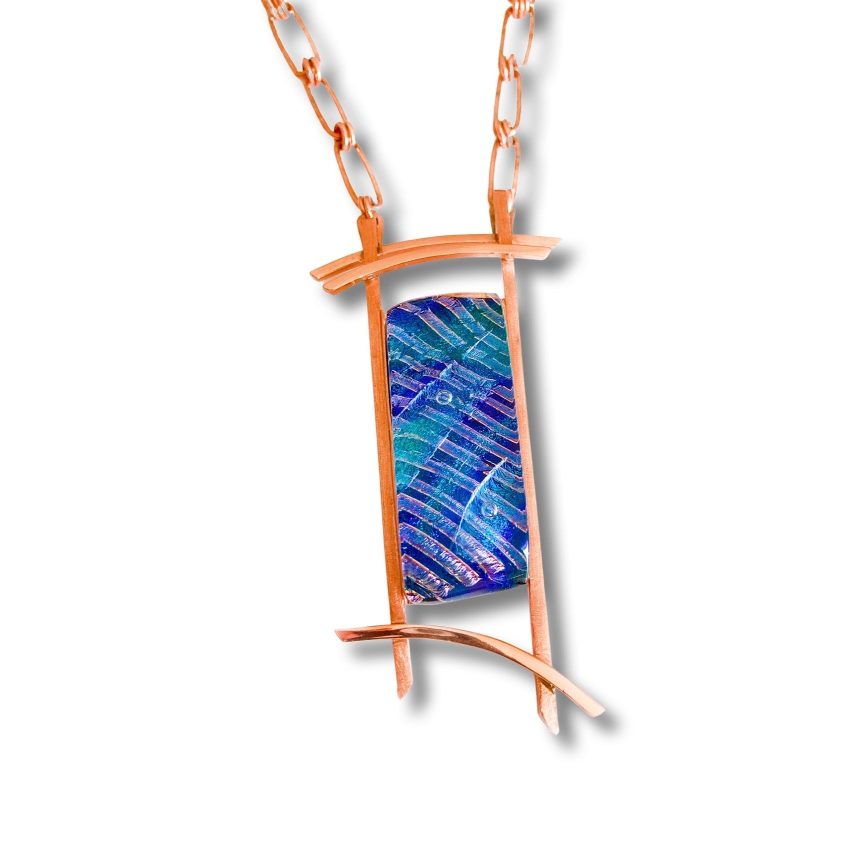Handcrafted modern dichroic glass set in a custom copper pendant setting and copper chain, by 3D Glass Designs.