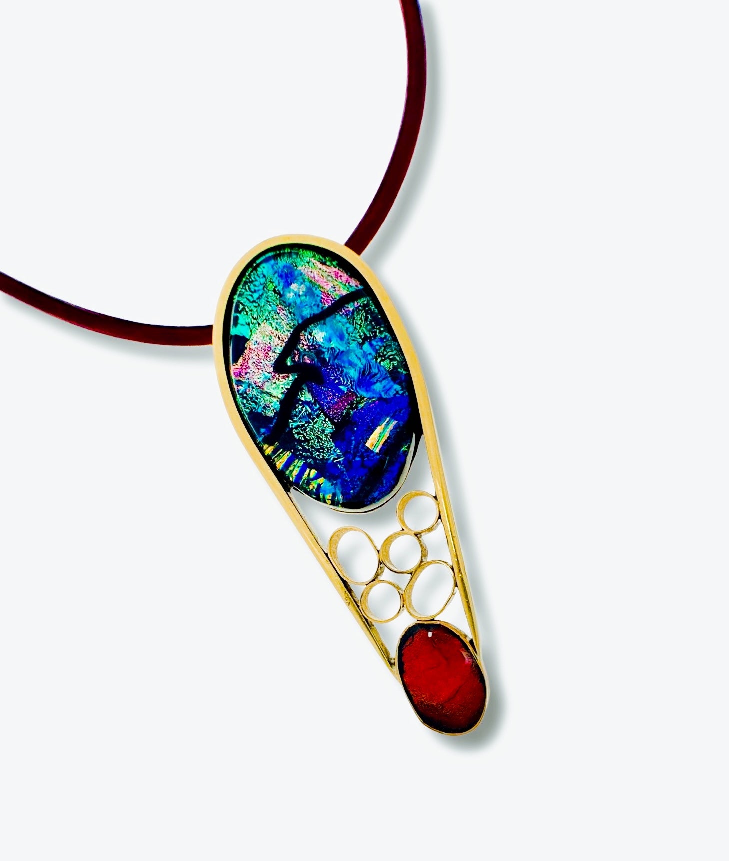 Contemporary dichroic glass and bass pendant with burgundy leather cord, handmade by 3D Glass Designs.