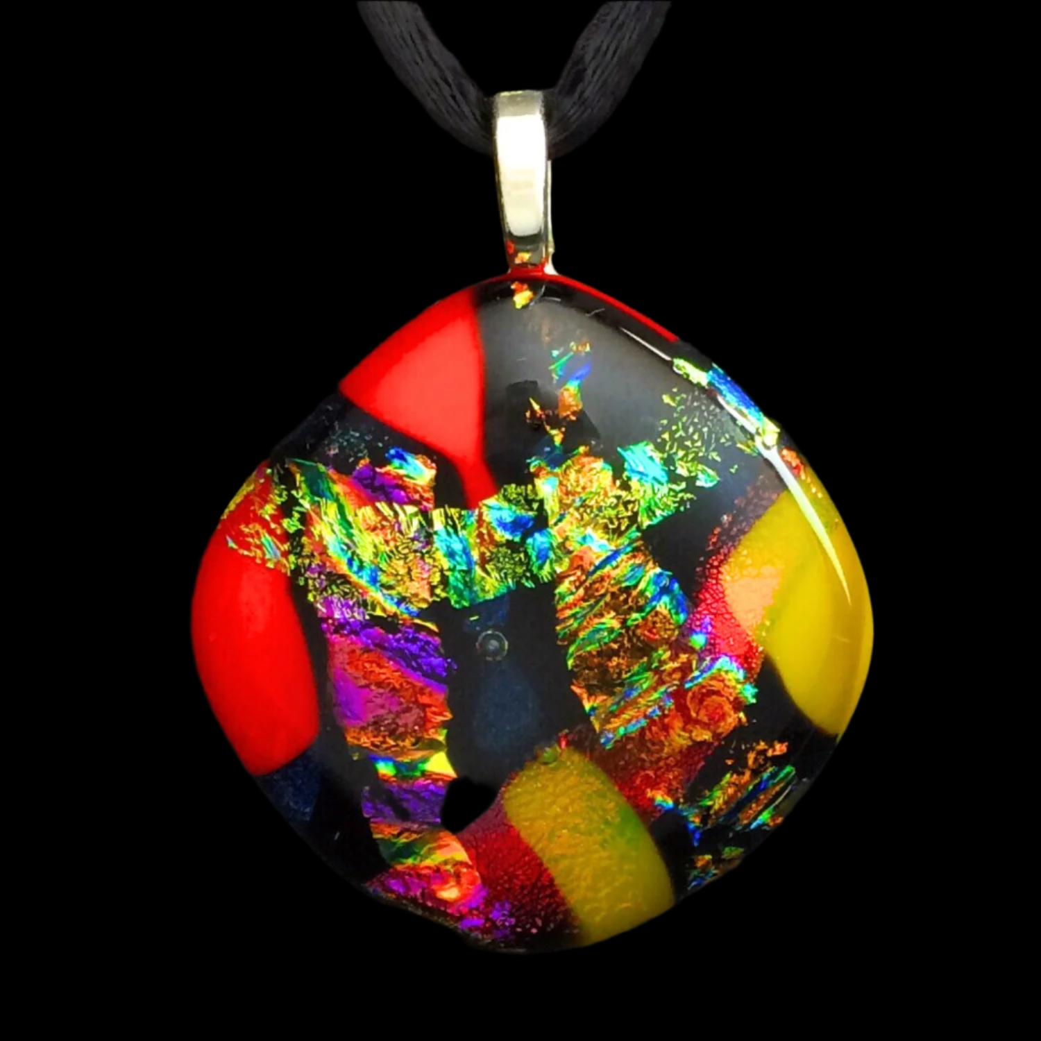 Colorful dichroic fused glass pendant in red, blue, yellow, purple, green and gold colors with a black satin cord. By 3D Glass Designs.