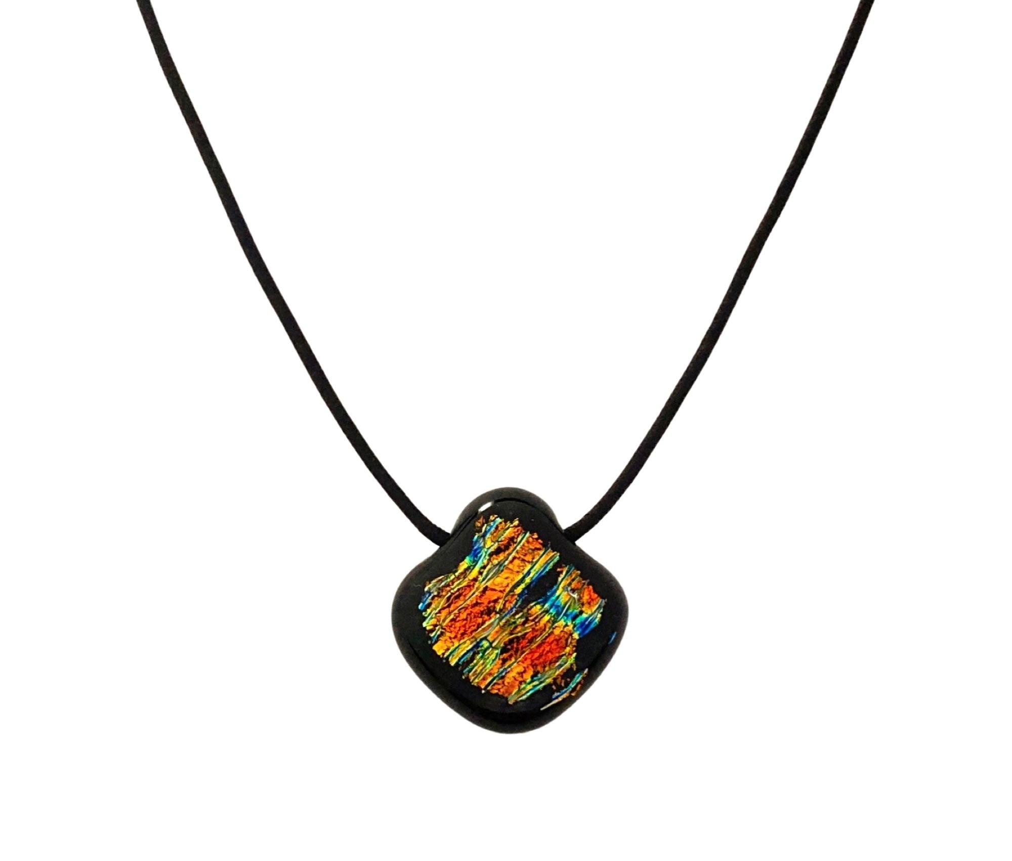 Colorful glass pendant on a black leather cord against a black background, by 3D Glass Designs.