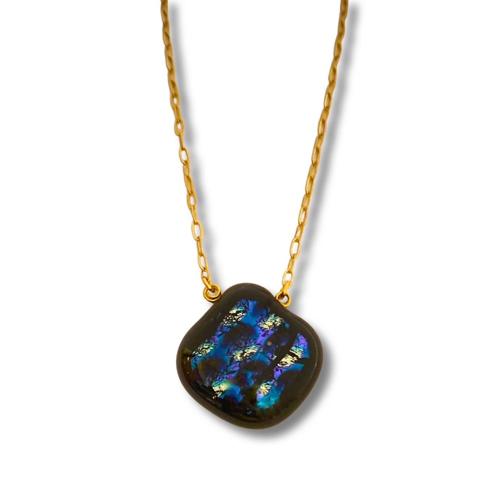 Pear-shaped glass pendant with a gold chain against a white background, by 3D Glass Designs.