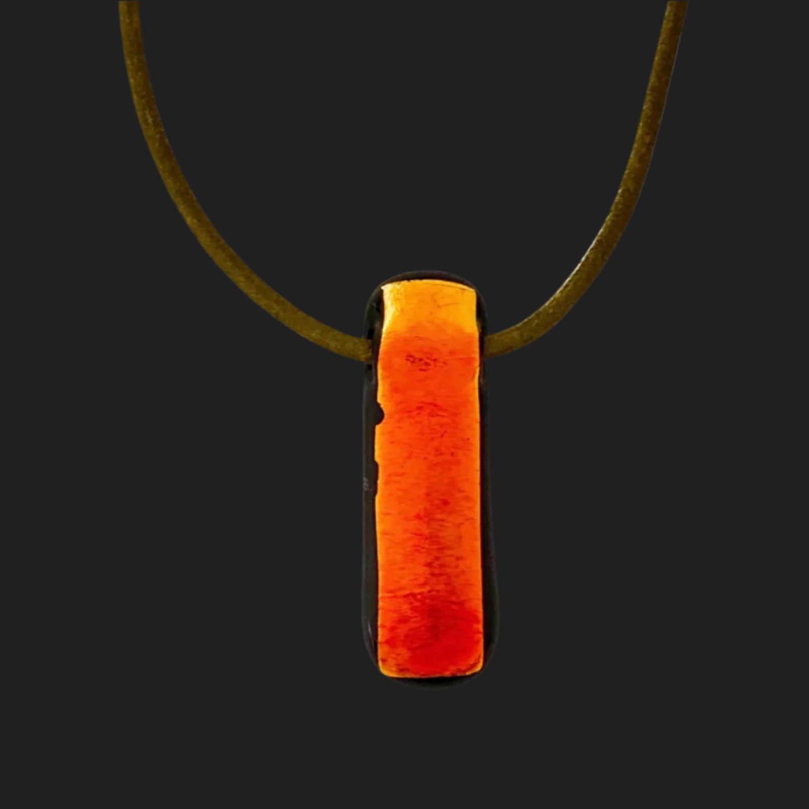 Red glass pendant against a dark background, by 3D Glass Designs.