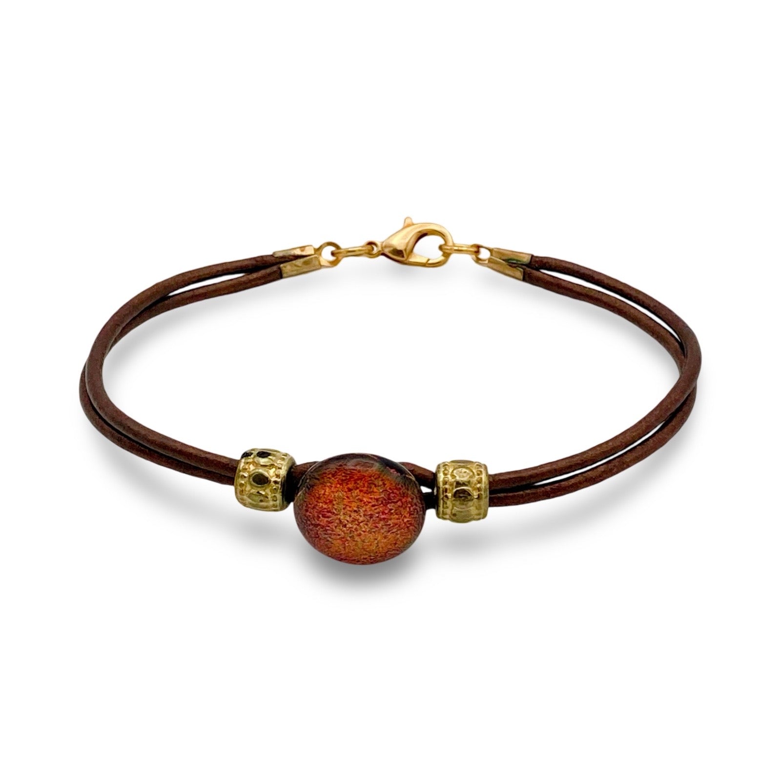 Leather bracelet with dichroic glass cabochon, by 3D Glass Designs.