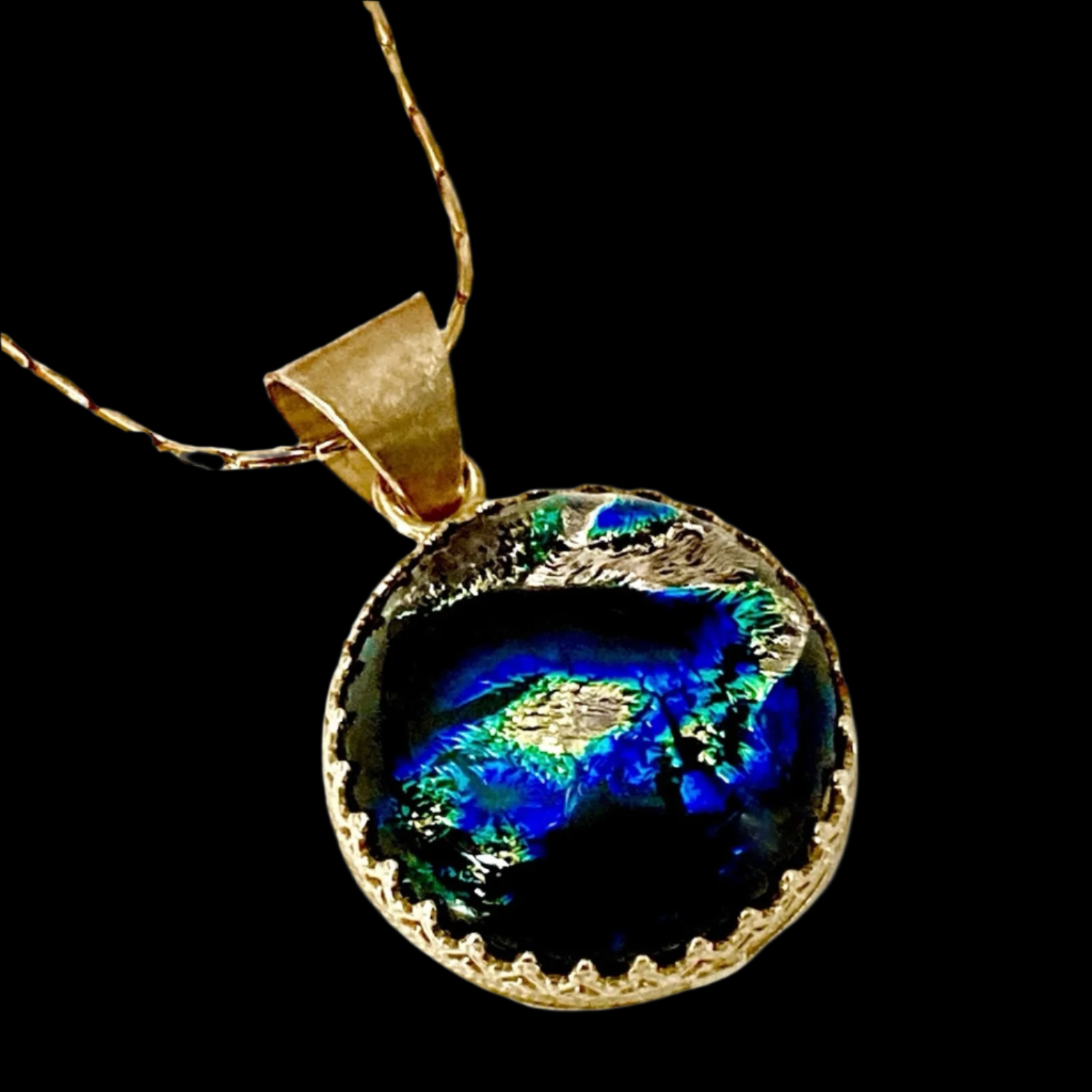Small handmade fused glass round pendant set in brass. By 3D Glass Designs.