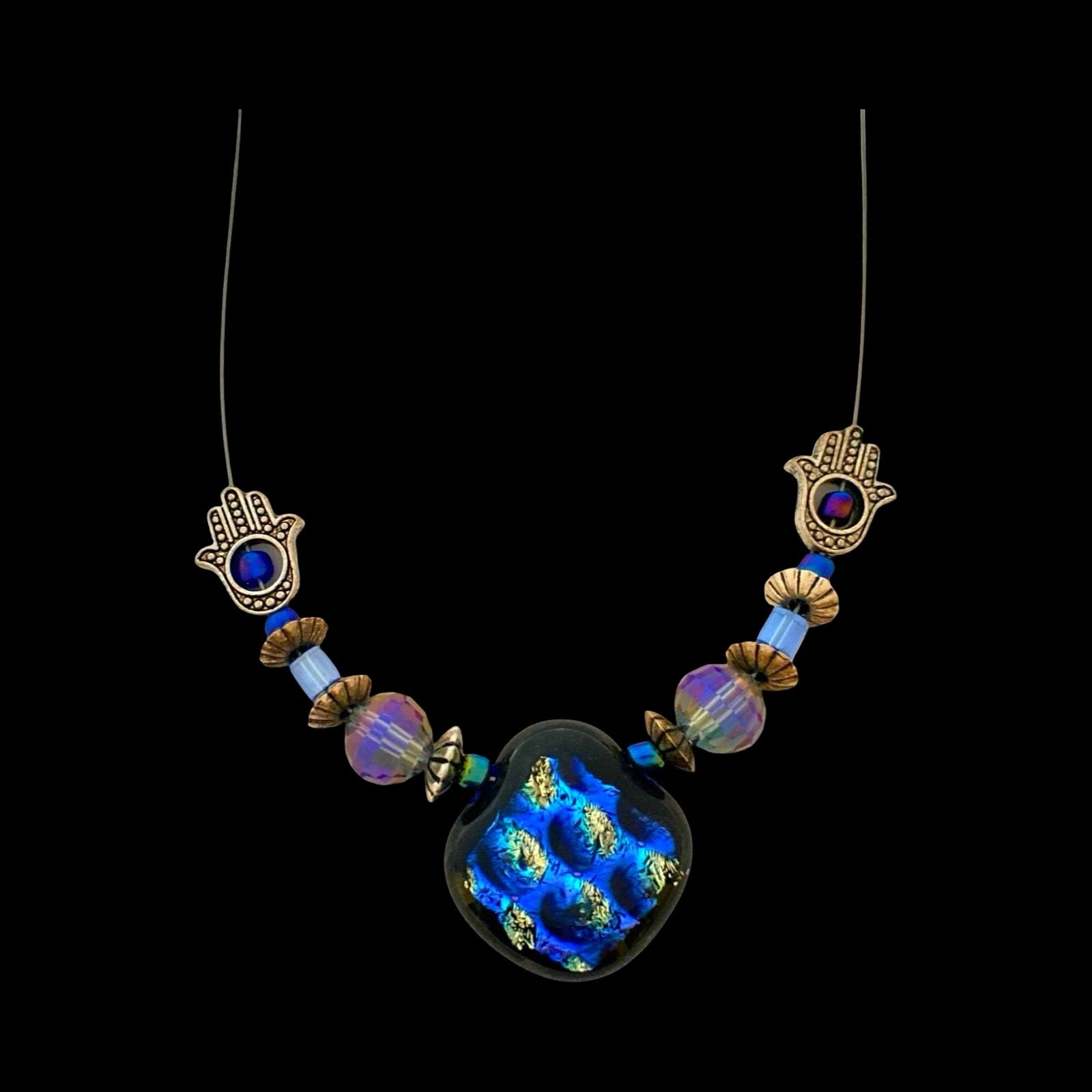 Beaded illusion style necklace on a black background, By 3D Glass Designs.