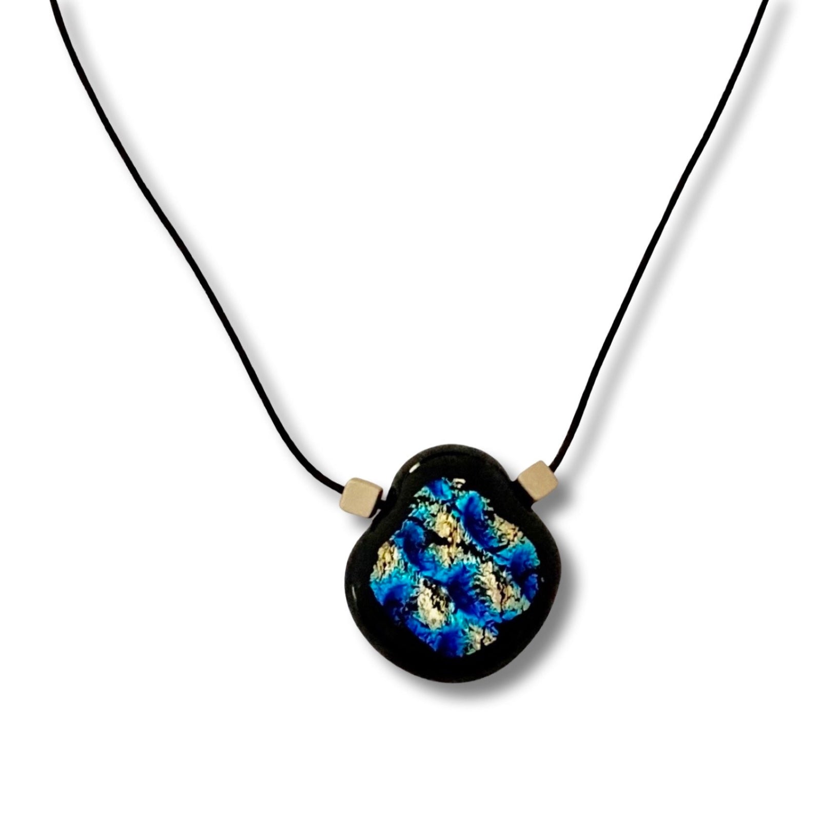 Pear shaped pendant on a black leather cord against a white background, by 3D Glass Designs.