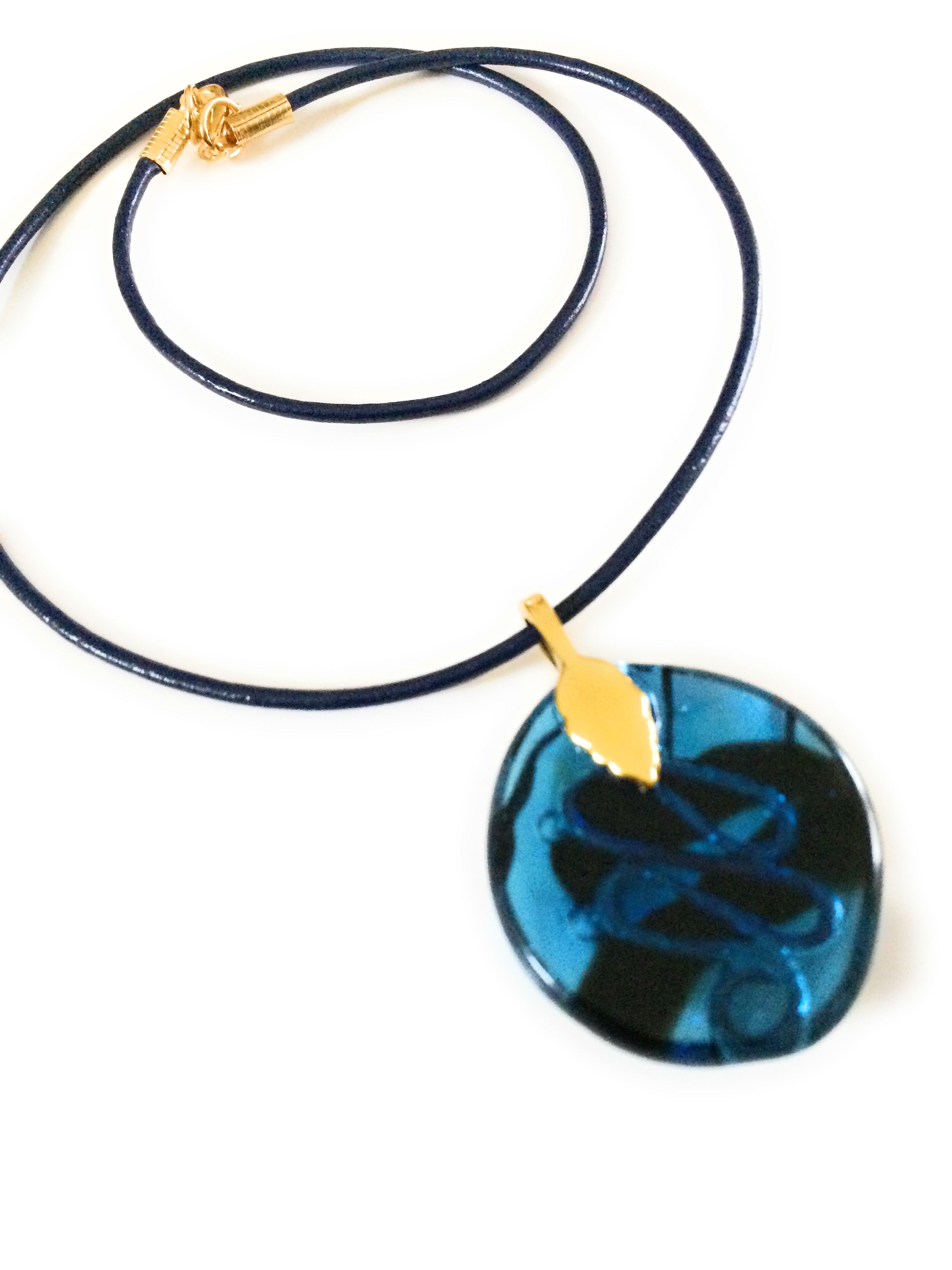 Back of transparent blue fused glass with copper squiggle design, by 3D Glass designs