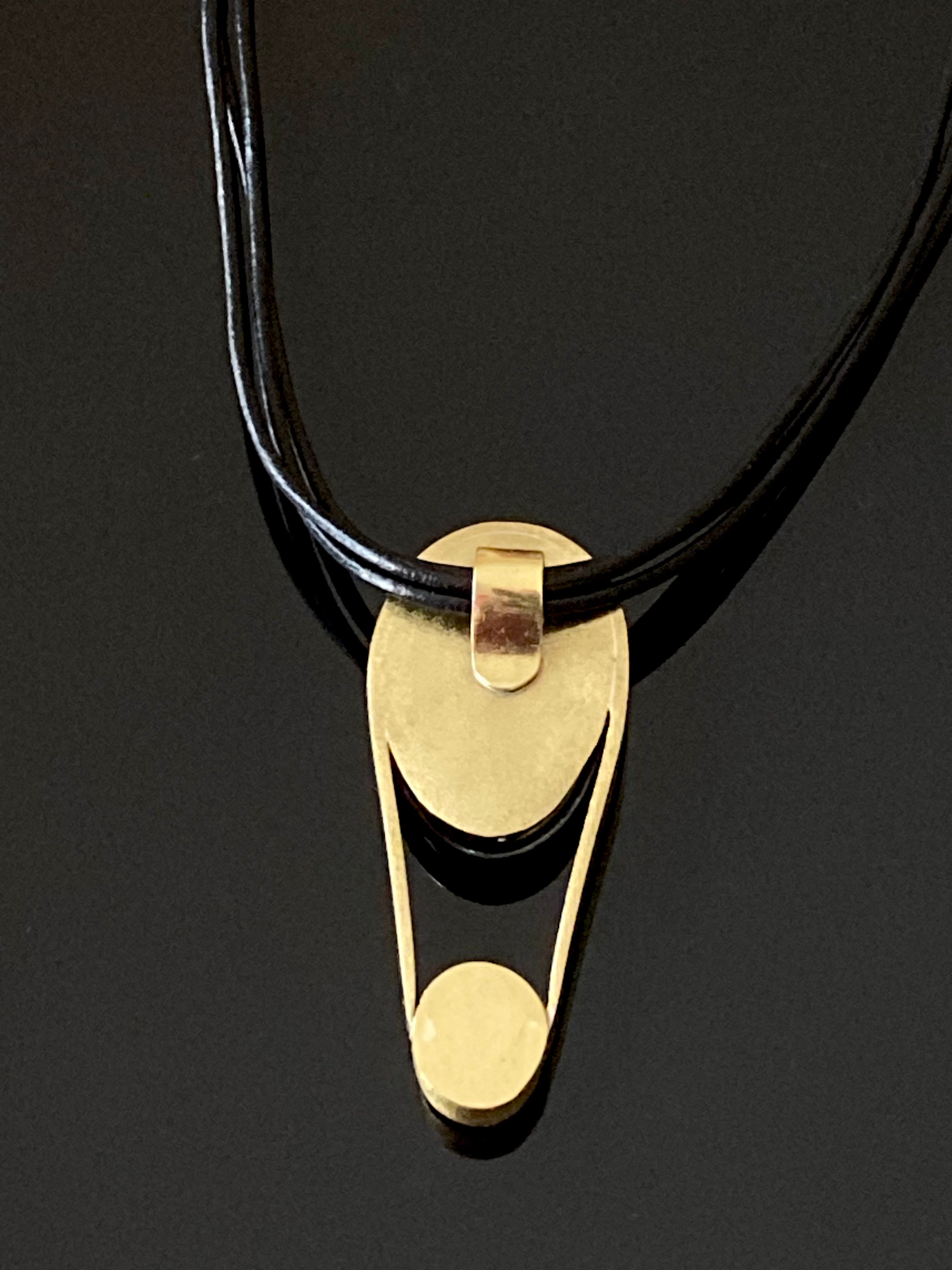 Back side of contemporary fused glass pendant set in brass, by 3D Gass Designs.