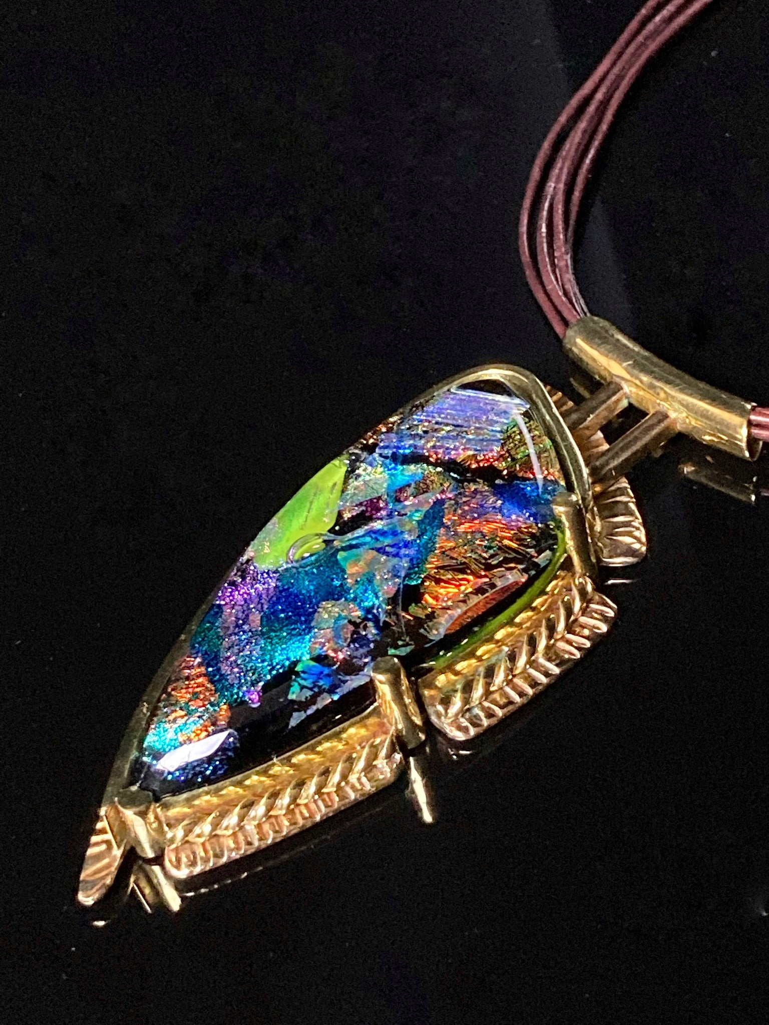 Unique handmade fused glass and brass pendant on a leather necklace, by 3D Glass Designs.