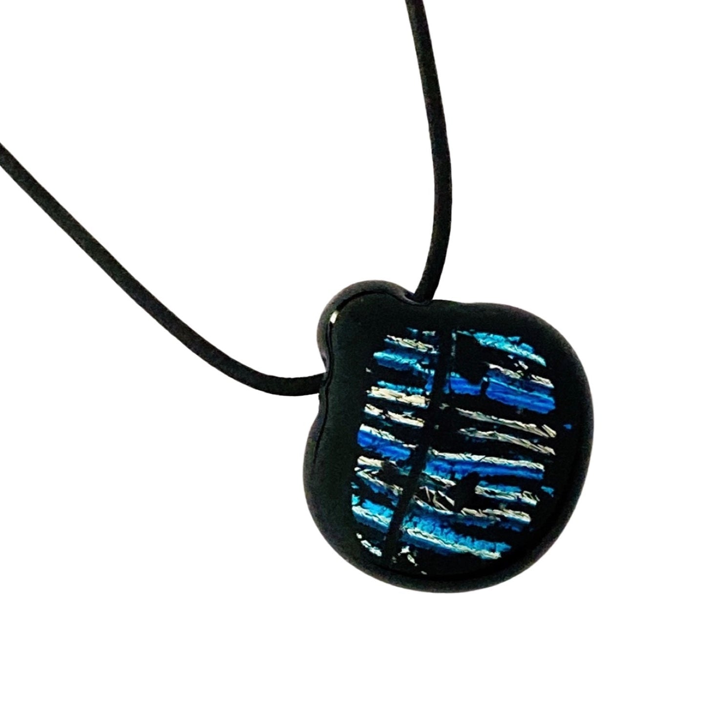 Black and blue striped fused glass pendant on a black leather cord against a white background, by 3D Glass Designs.