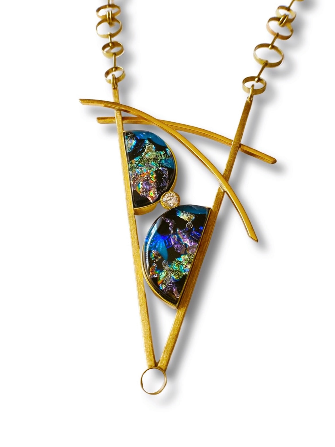 Geometric inspired brass pendant with teal fused glass in semi-circles and CZ, framed in a V with two slightly curved arch's above. Necklace made of various sized circles linked together, by 3D Glass Designs.