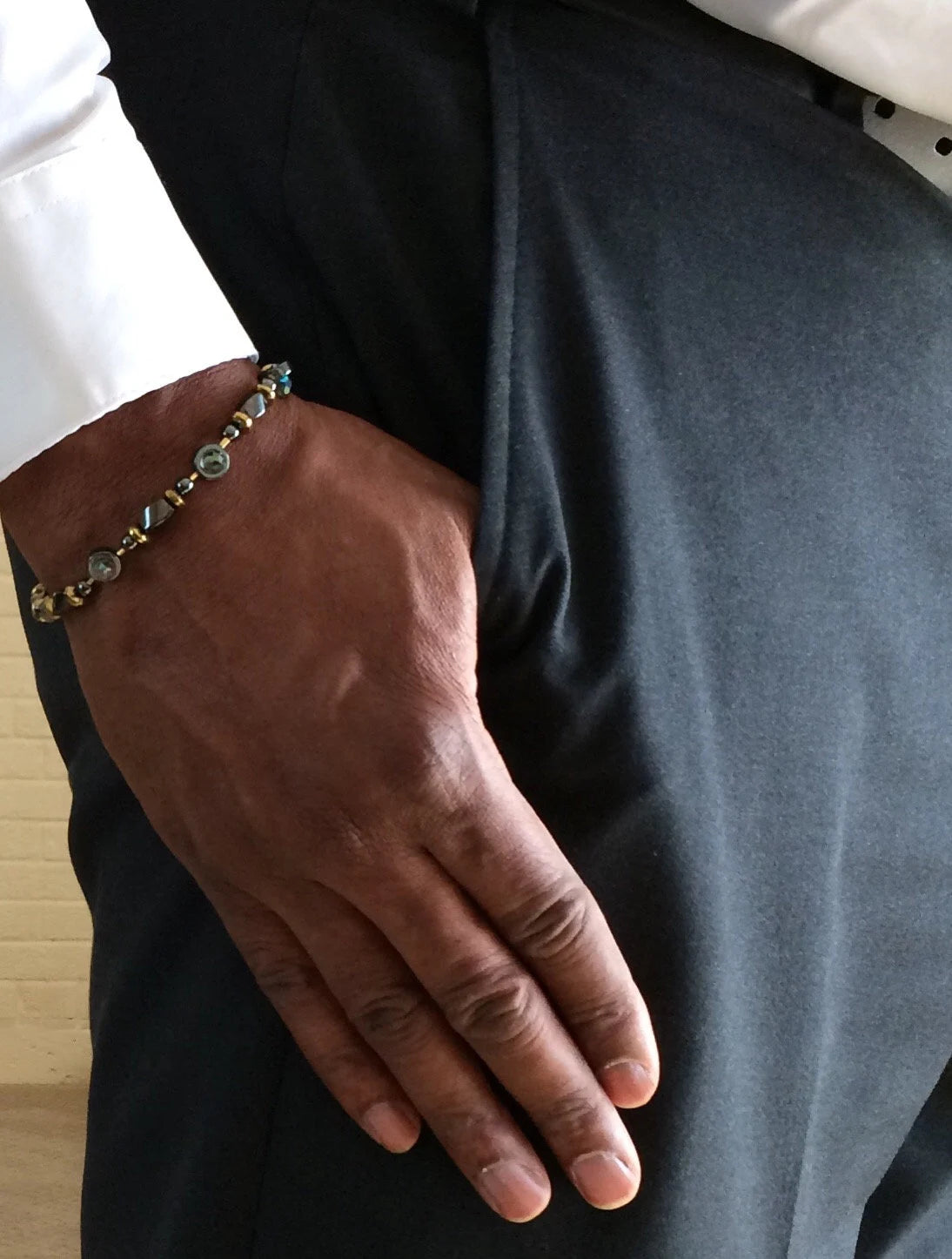 Model wearing hematite and crystal beaded bracelet, by 3D Glass Designs.