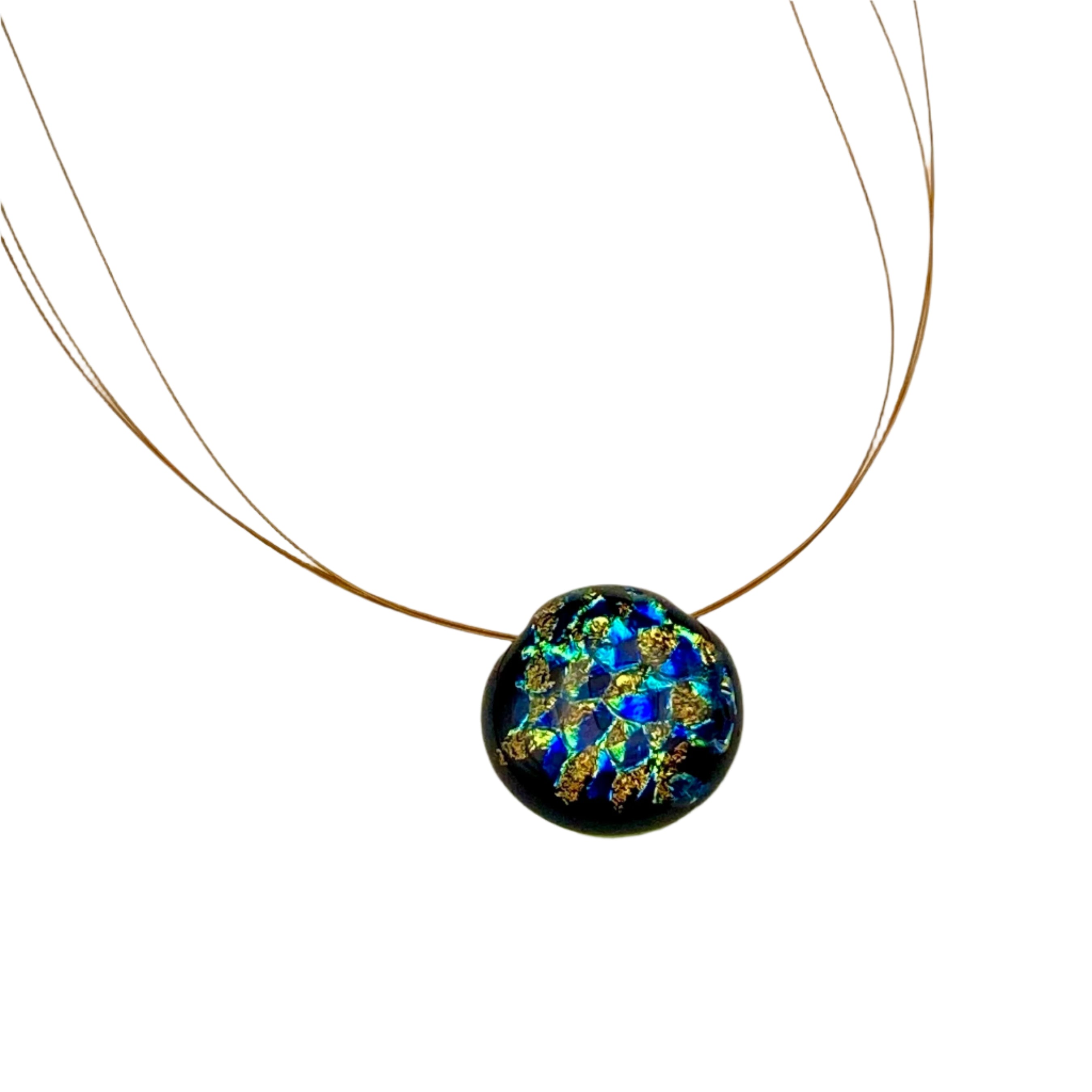 Small round glass pendant on three gold cords against a white background, by 3D Glass Designs.