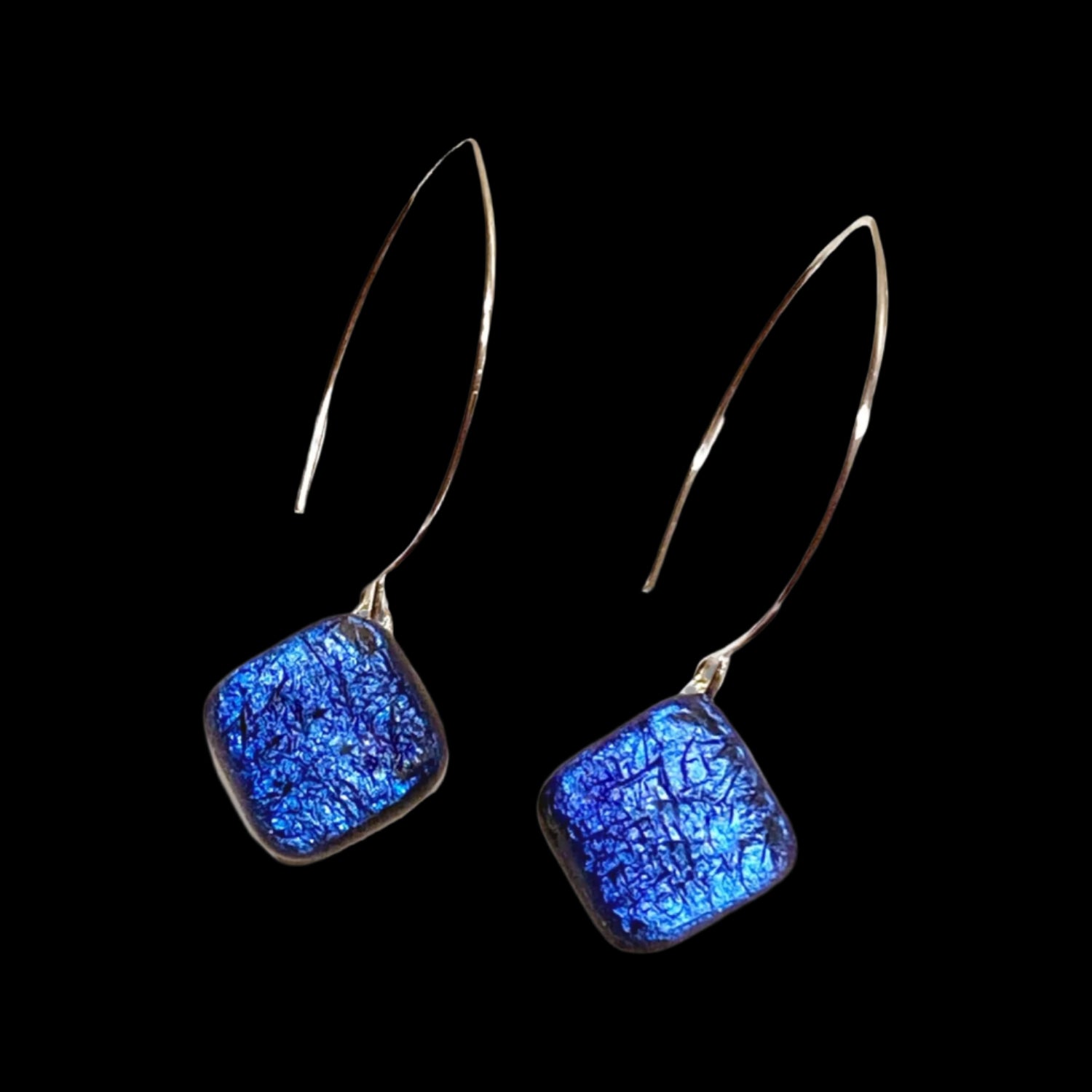 A pair of long earrings with a blue diamond-shaped dangle, by 3D Glass Designs.