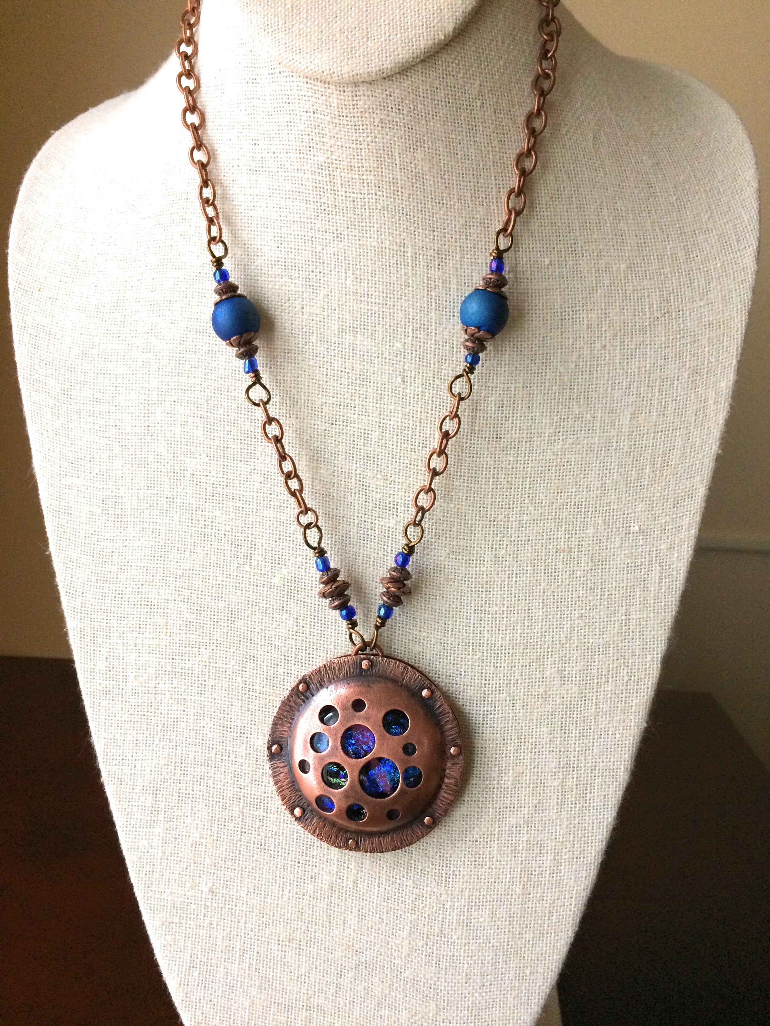 Round copper and dichroic glass pendant on a beaded copper chain, by 3D Glass Designs.