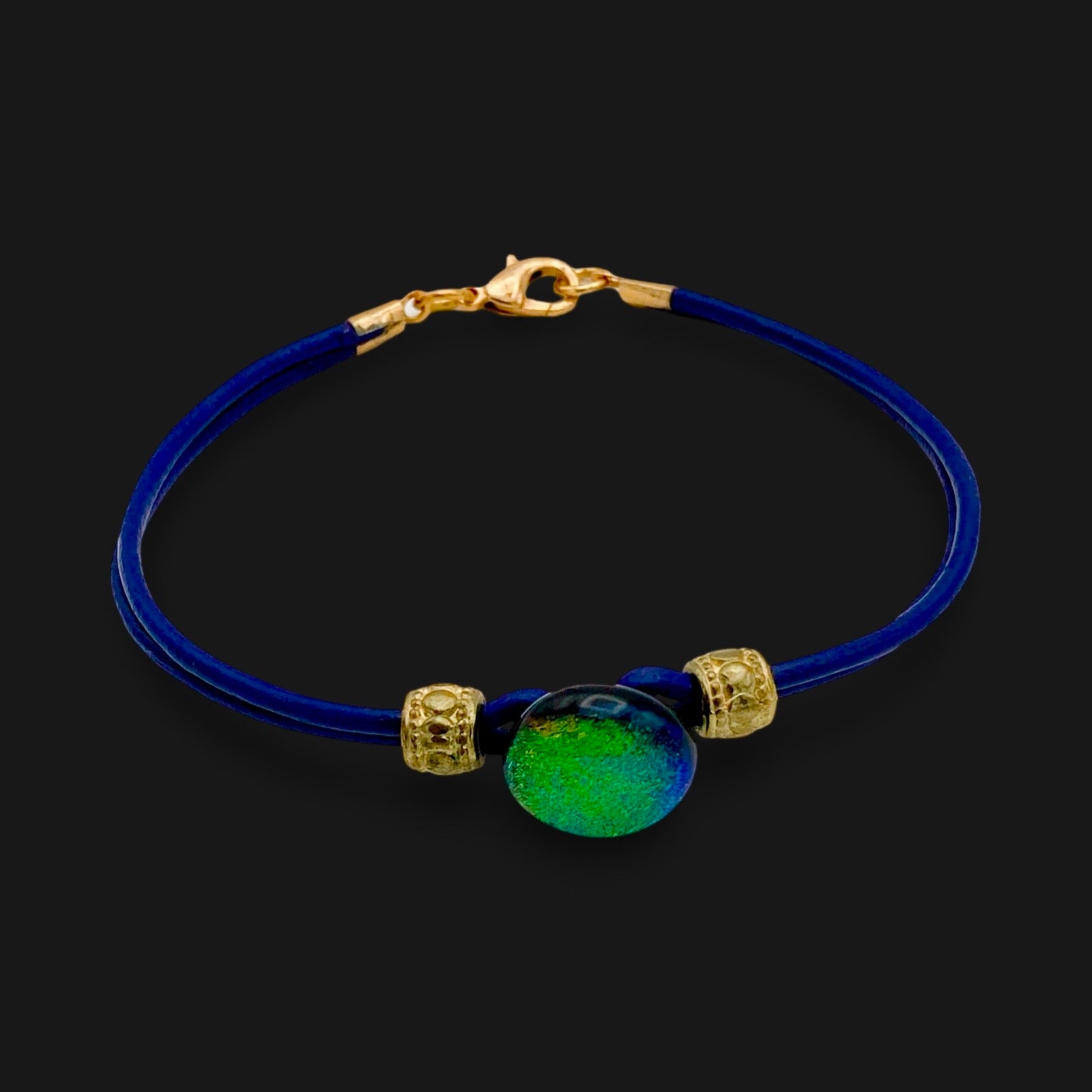 Handmade blue leather bracelet with green dichroic glass, by 3D Glass Designs.