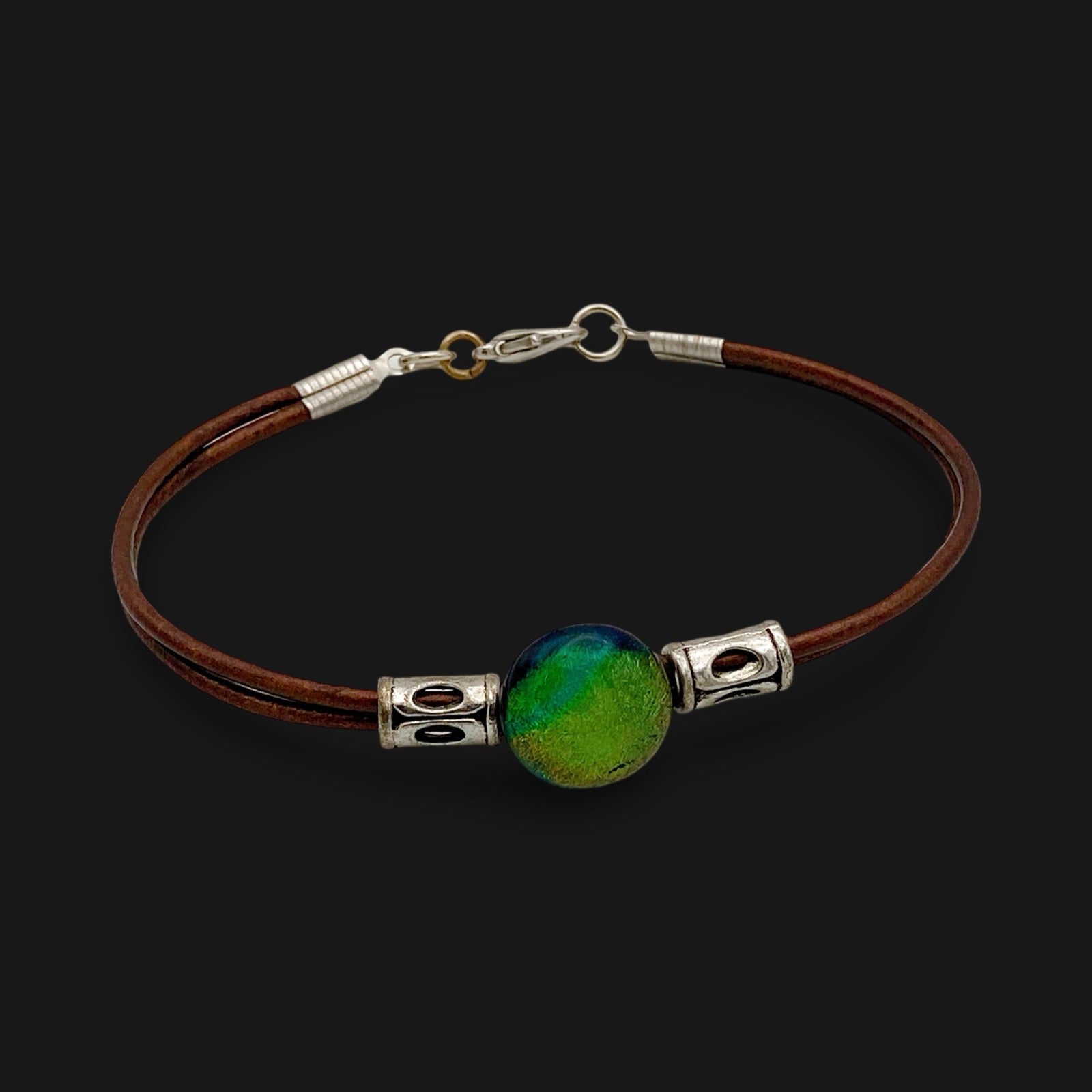 Green fused glass with metallic bronze leather cord. handmade by 3D Glass designs.