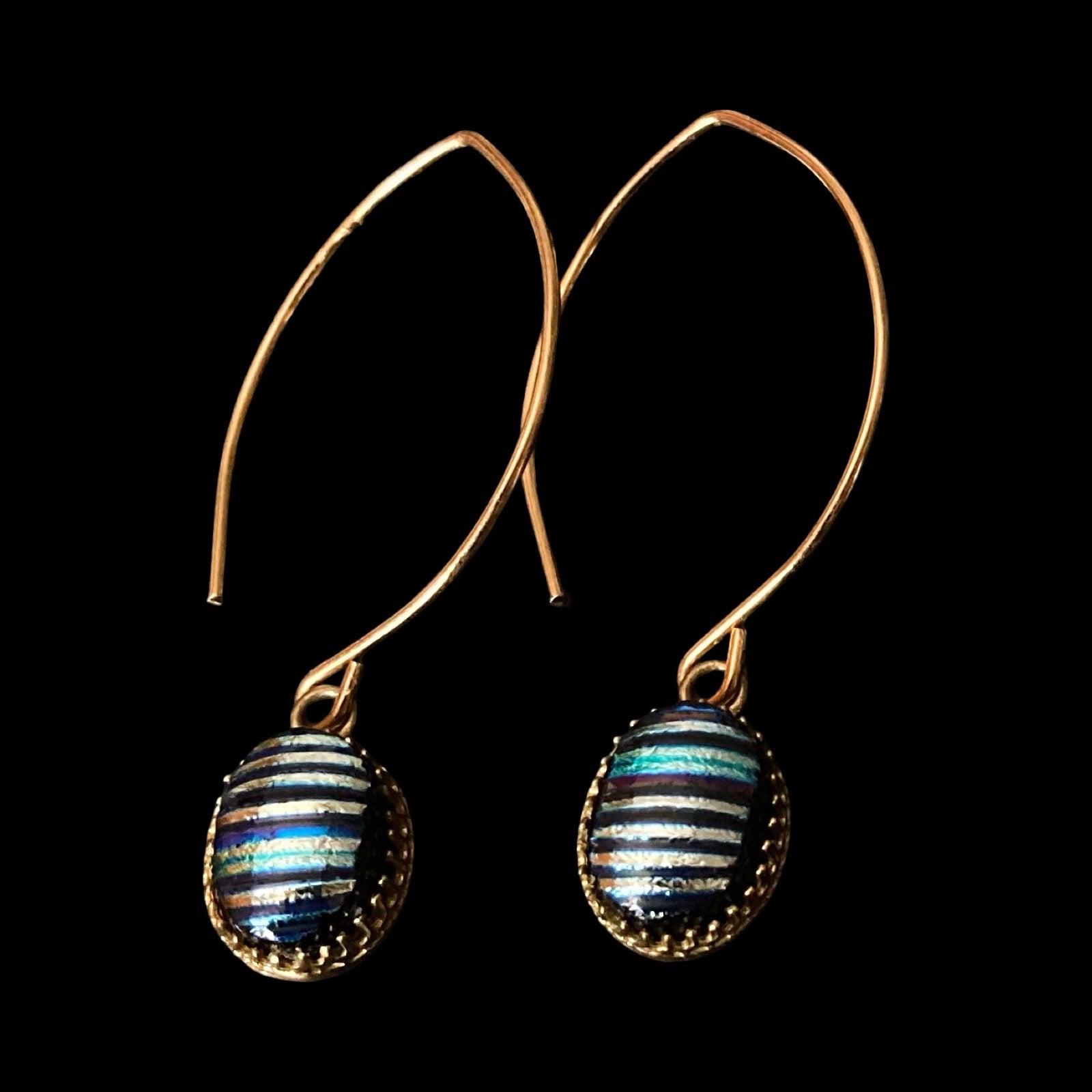 A pair of blue striped dangle earrings with long gold-plated ear wires, by 3D Glass Designs.