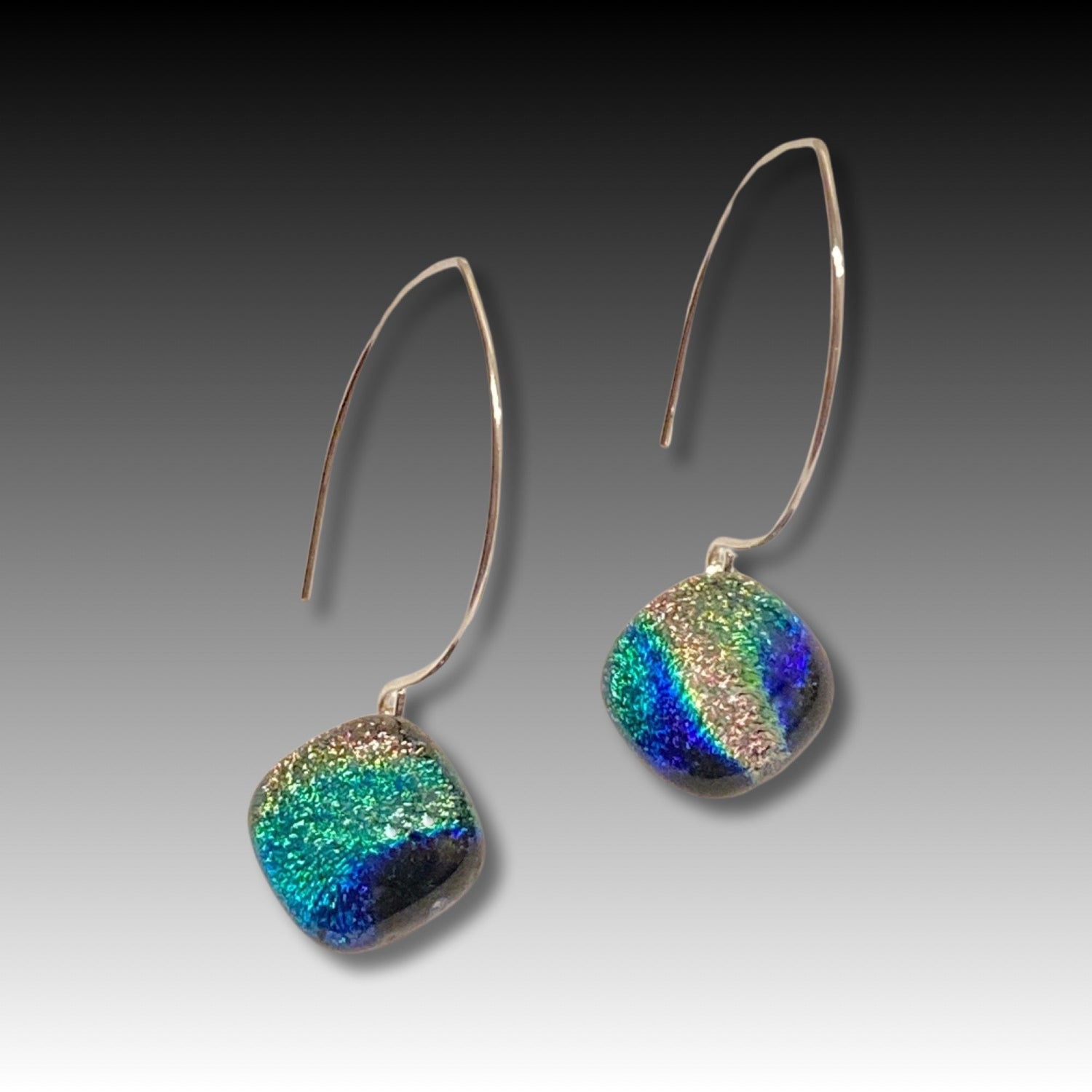 A pair of pierced earrings with a dichroic glass drop, by 3D Glass Designs