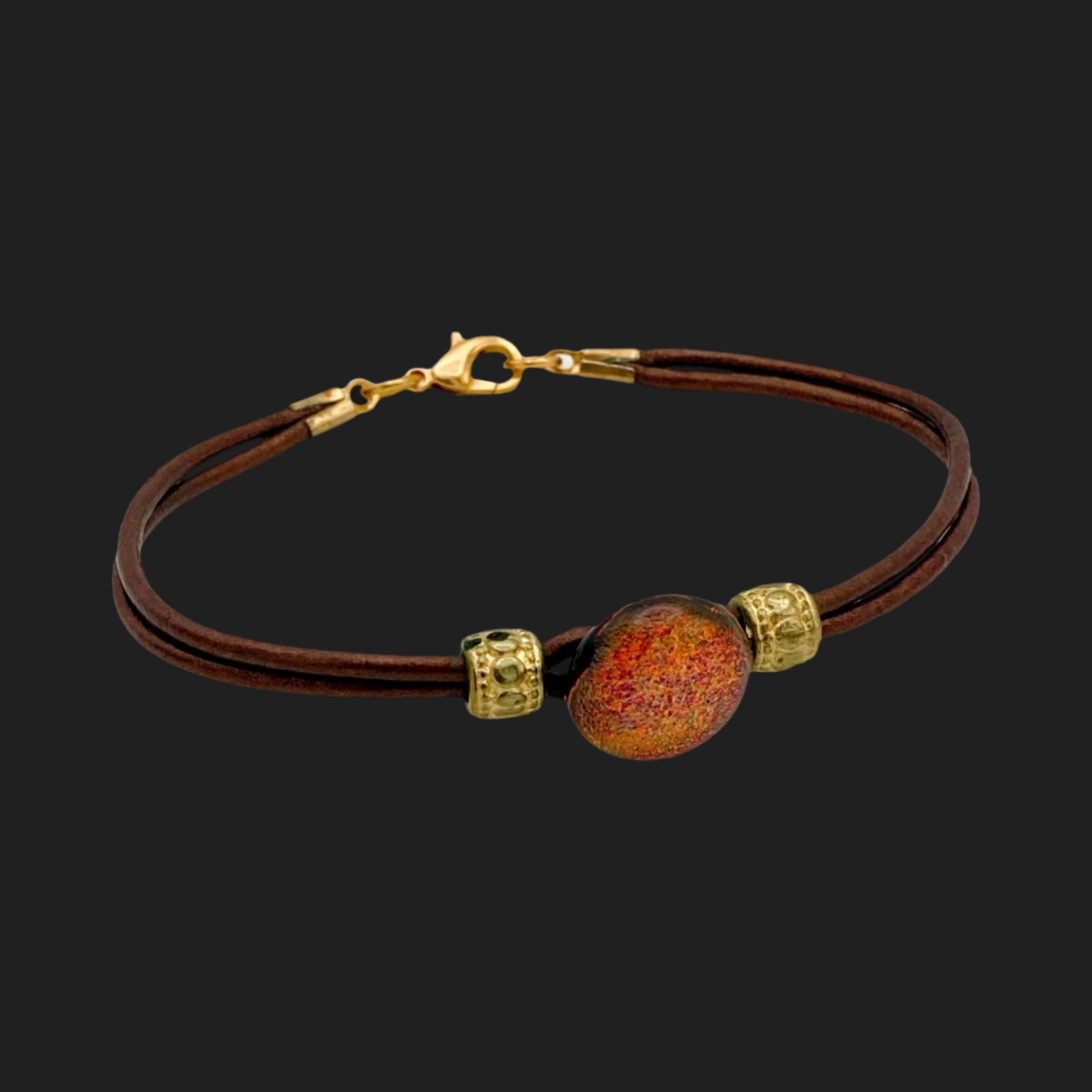 Leather bracelet with dichroic glass cabochon, by 3D Glass Designs.