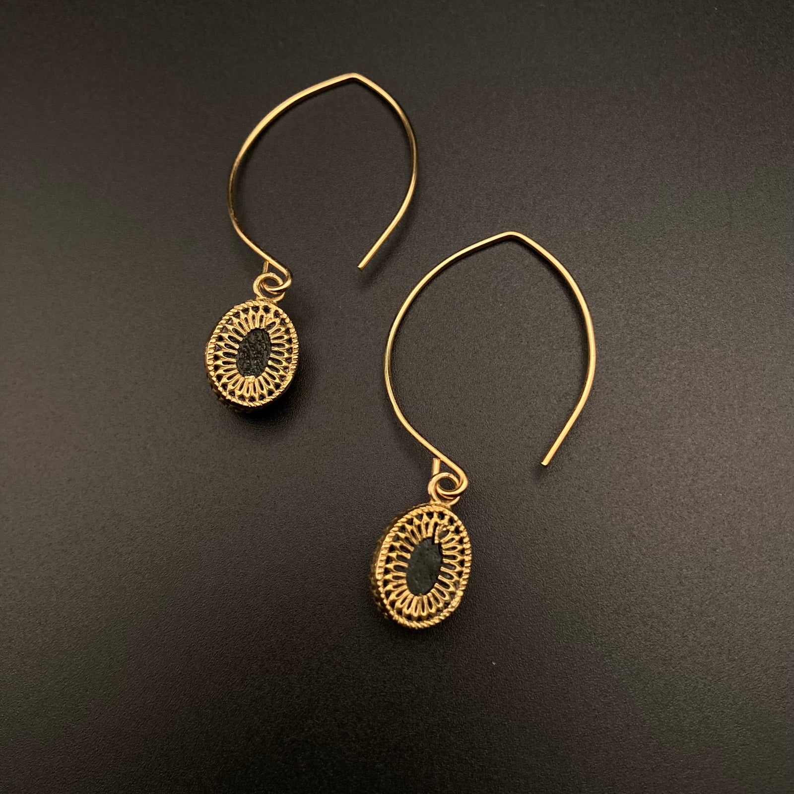 Backside of glass earrings set in a unique brass setting, by 3D Glass Designs.