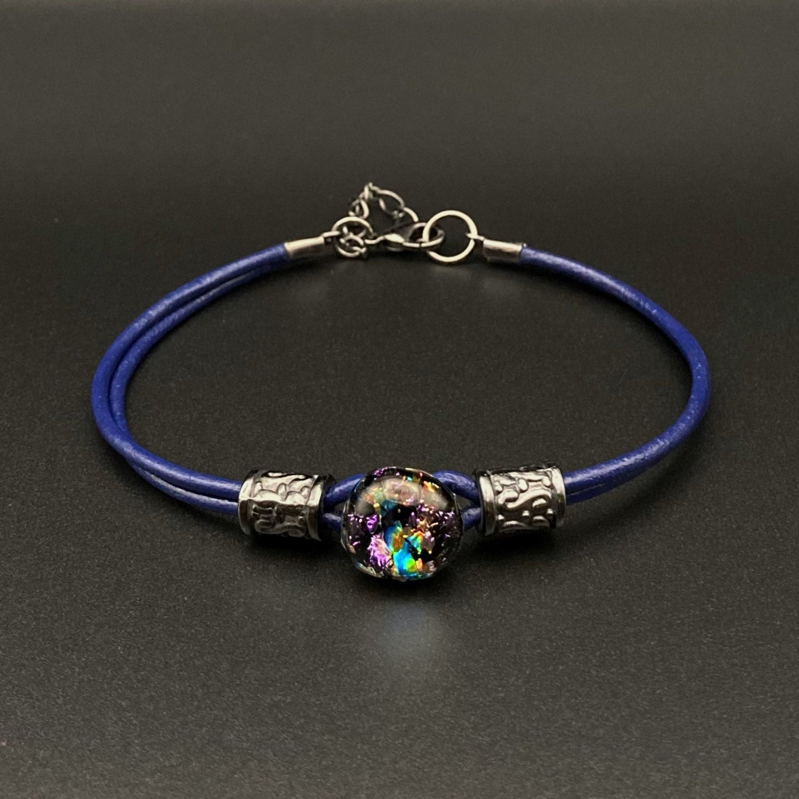 Blue leather bracelet with a round purple and teal glass focal with beads, by 3D Glass designs.